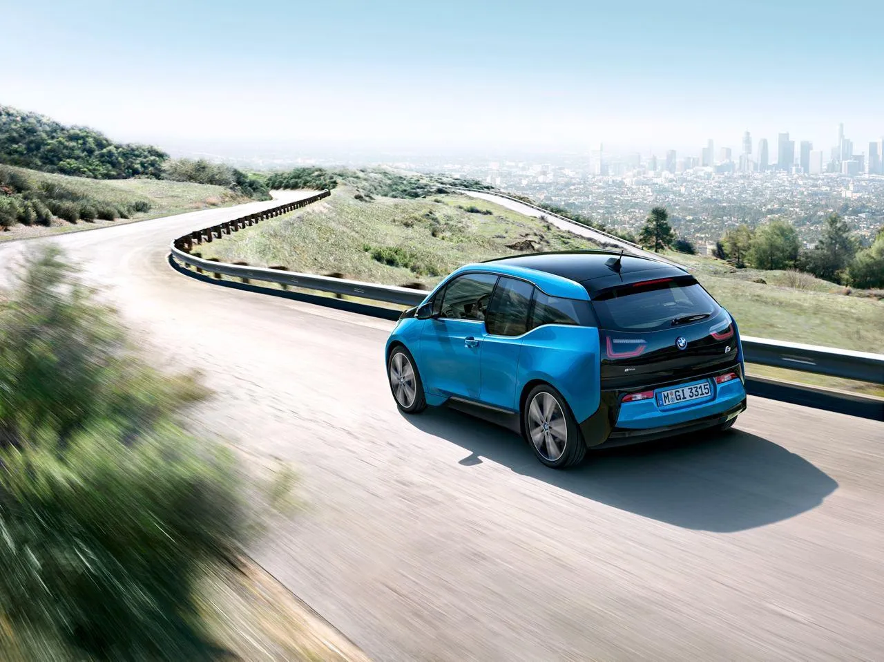 Bmw I3 Electric Vehicle Cruising on a Scenic Highway