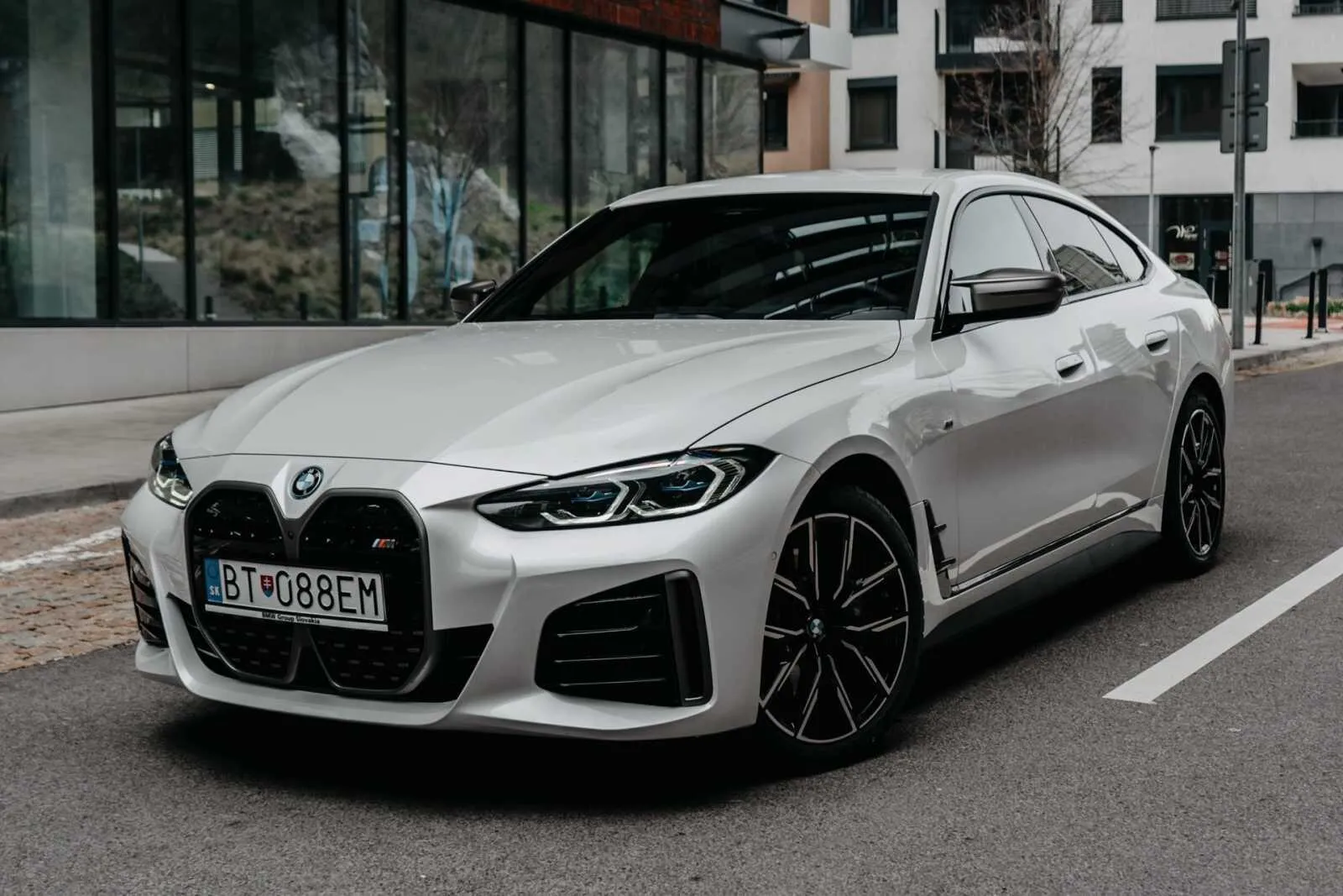 Bmw I4 Electric Sedan Parked on a City Street Hd Image