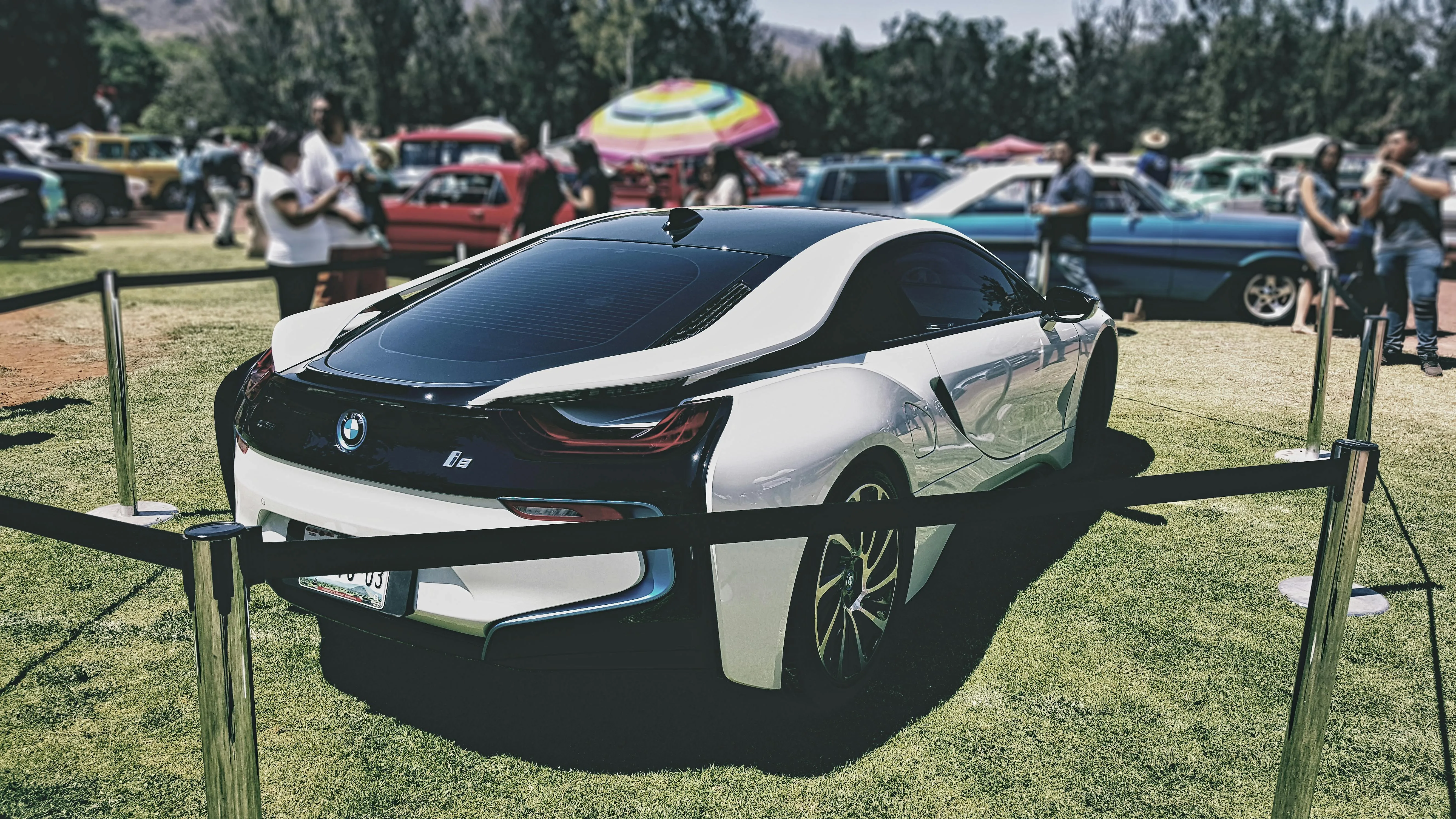 Bmw I8 Hybrid Sports Car on Display at Outdoor Event