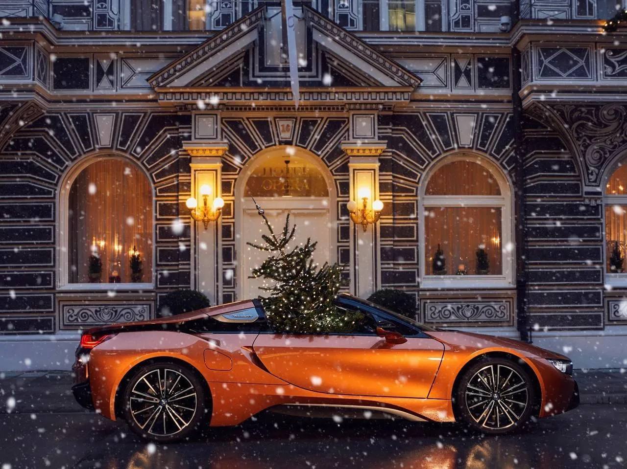 Bmw I8 Parked Outside Luxury Hotel Decorated with Lights
