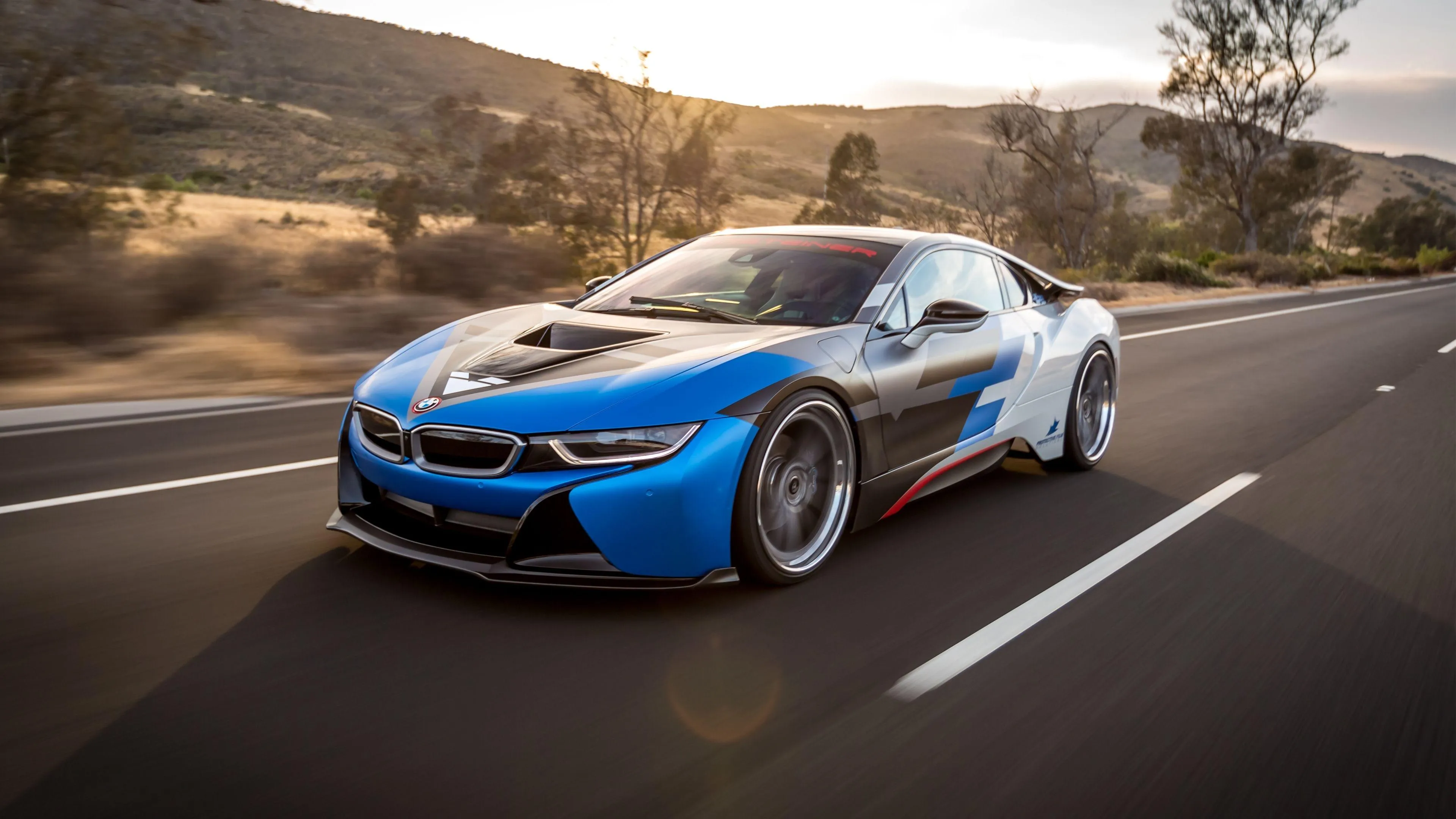 Bmw I8 Sports Car Speeding on a Scenic Countryside Road