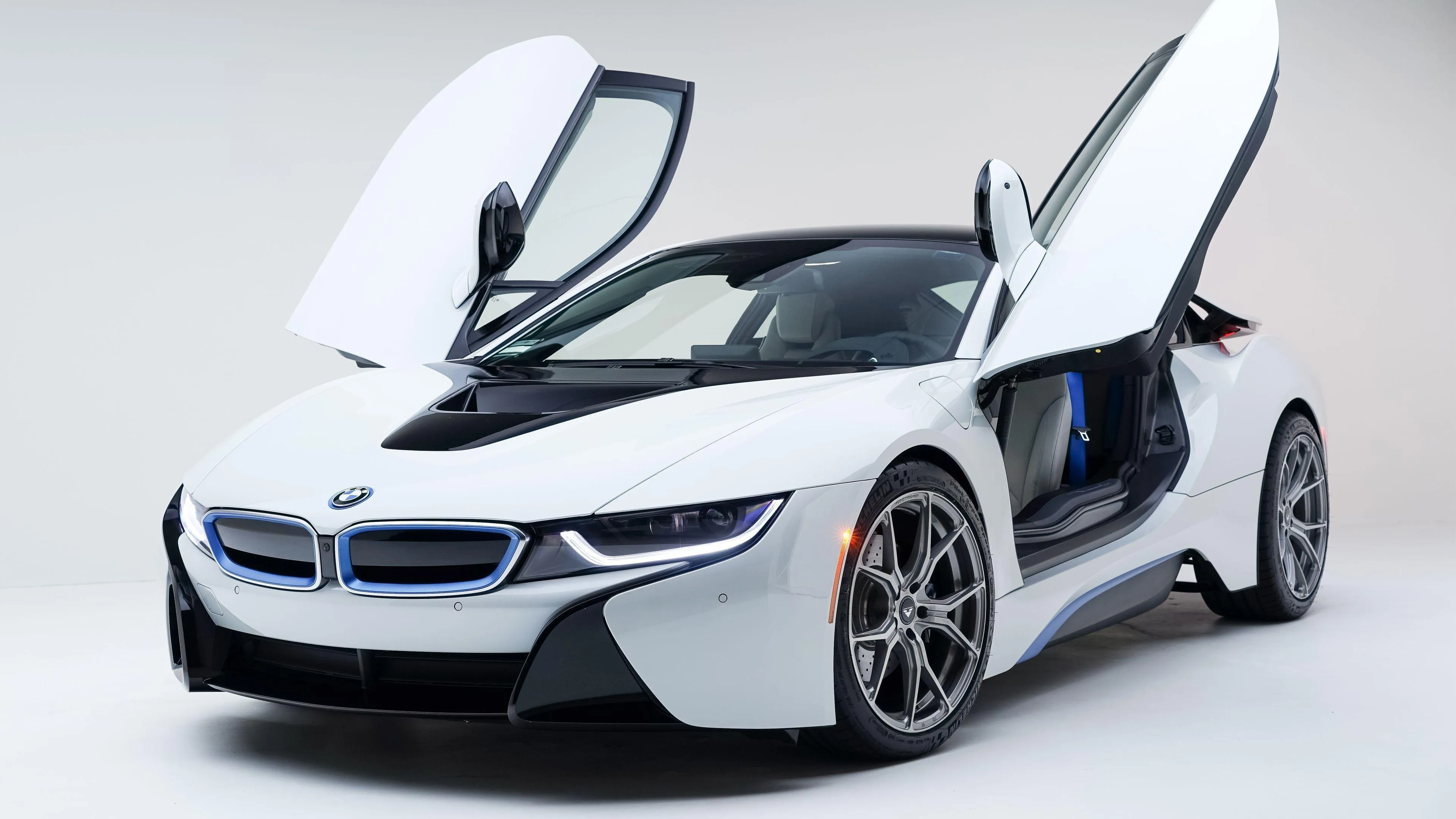 Bmw I8 with Butterfly Doors Open in White Studio Background