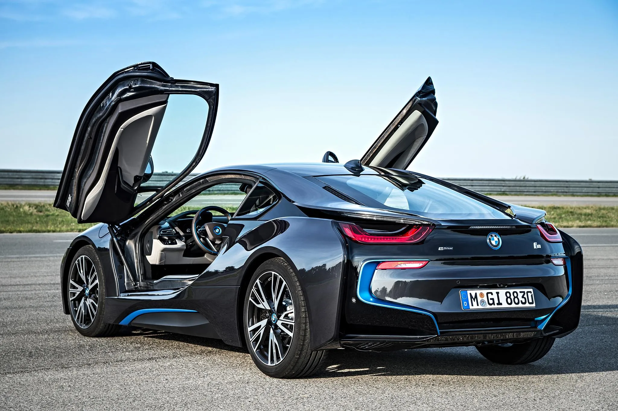 Bmw I8 with Butterfly Doors Open on Clear Sunny Day
