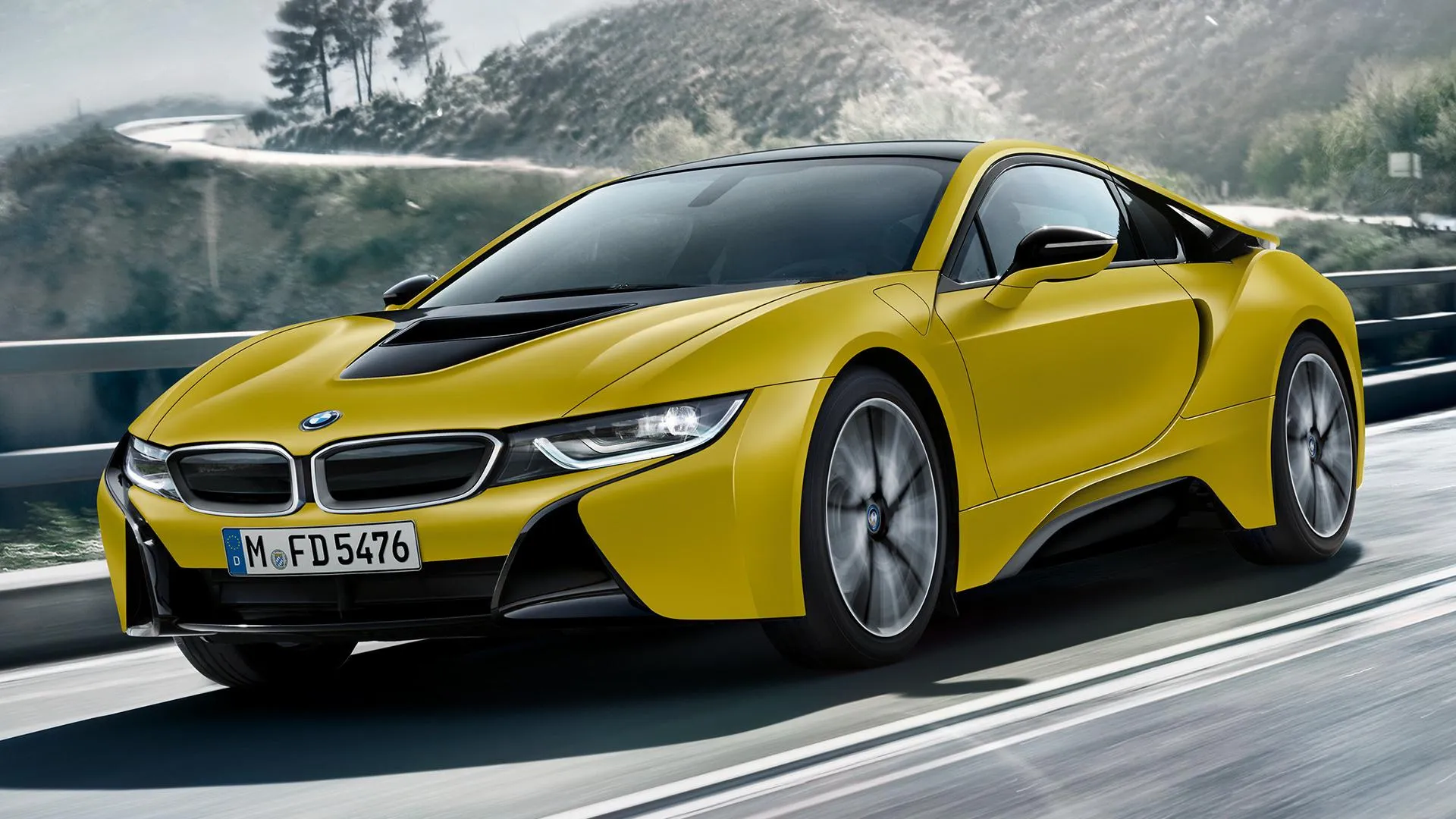 Bmw I8 Yellow Sports Car Driving on a Scenic Road Wallpaper