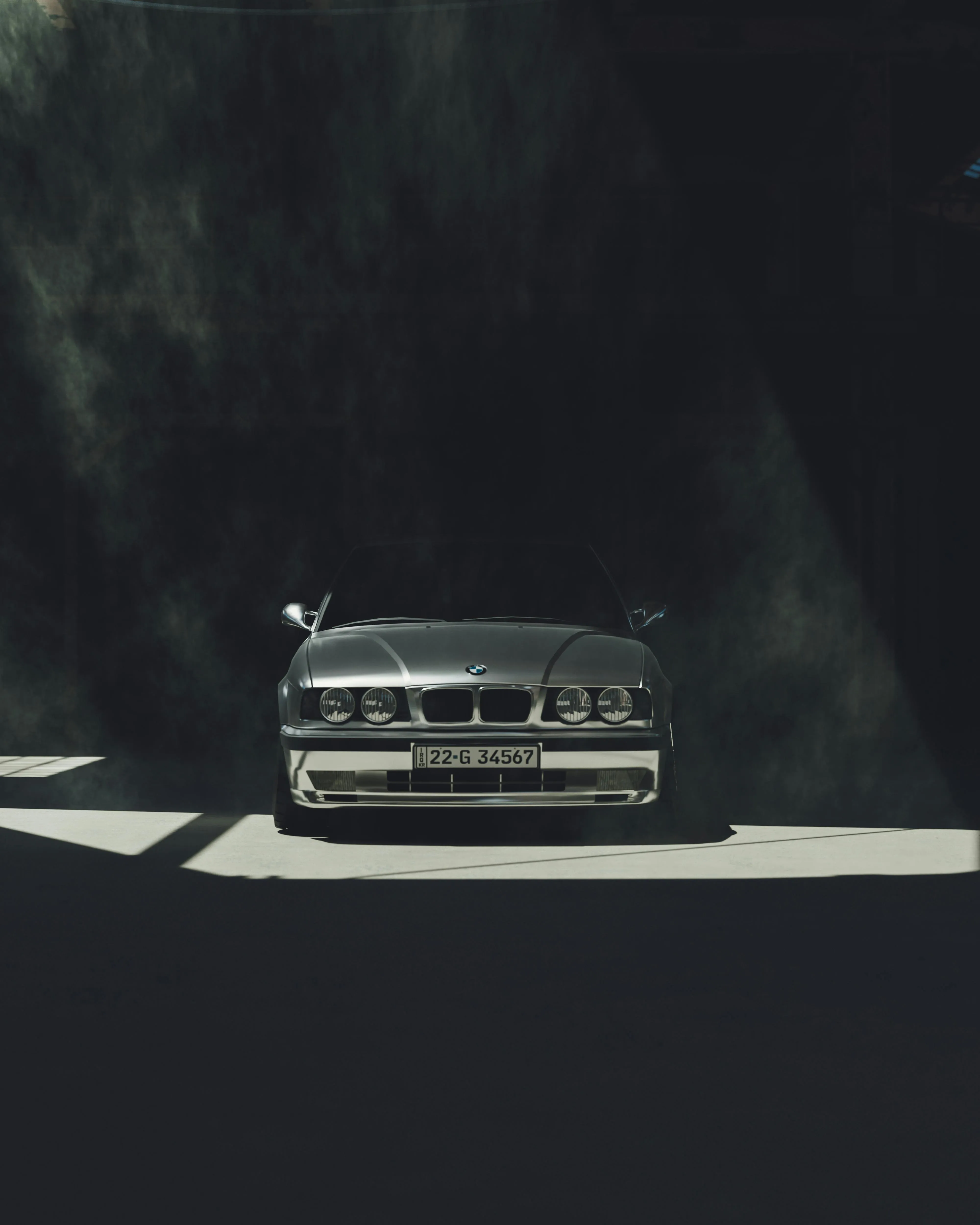 Bmw in Dramatic Lighting Driving Through Shadows Wallpaper