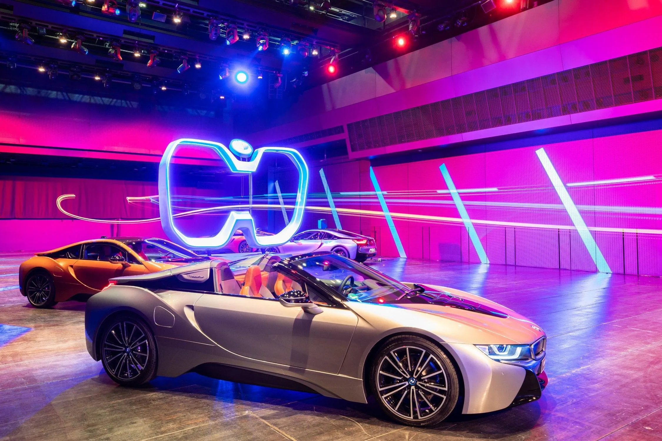Bmw in Futuristic Neon Lit Showroom with Purple Glow