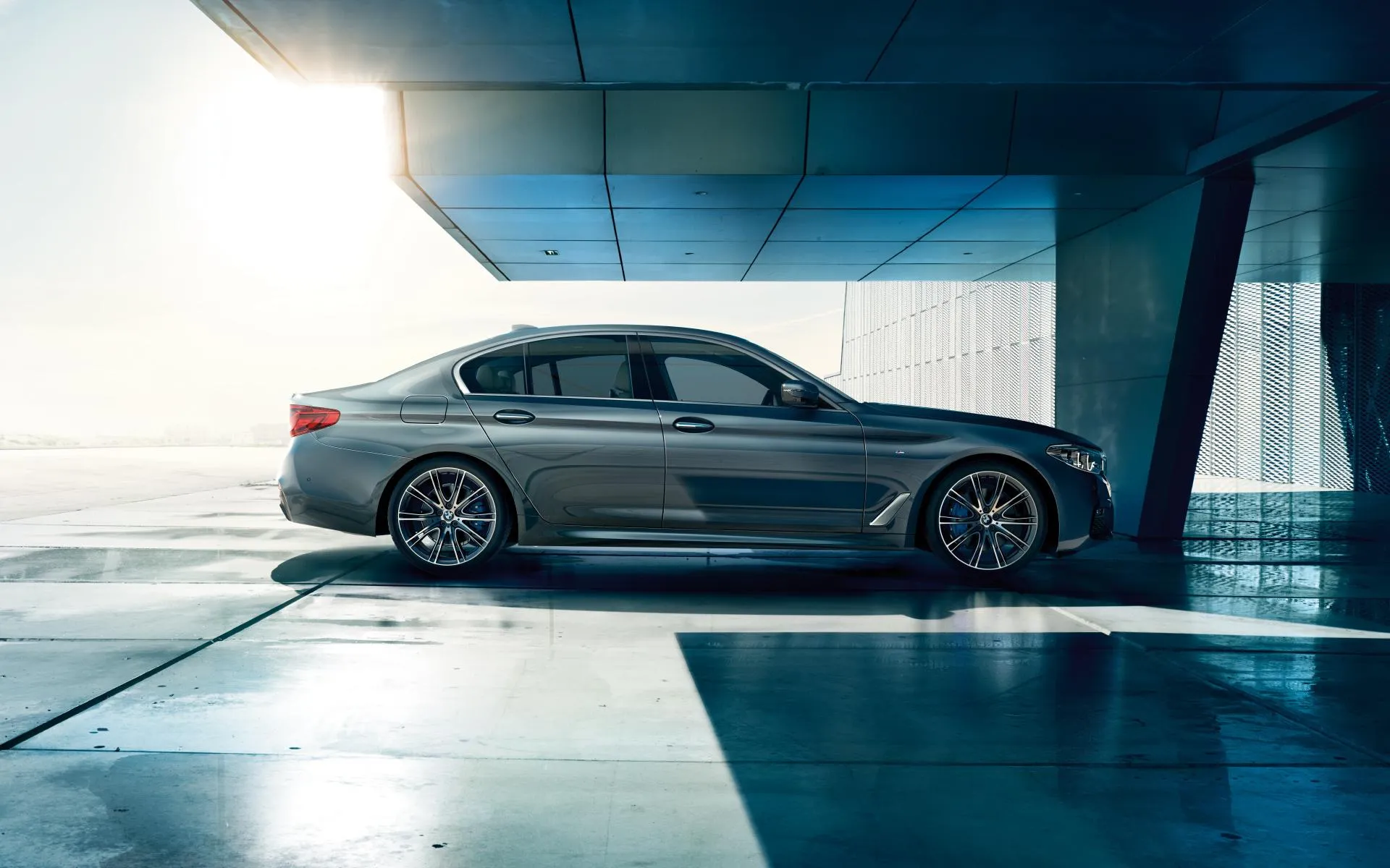 Bmw in Futuristic Parking Garage Under Bright Light