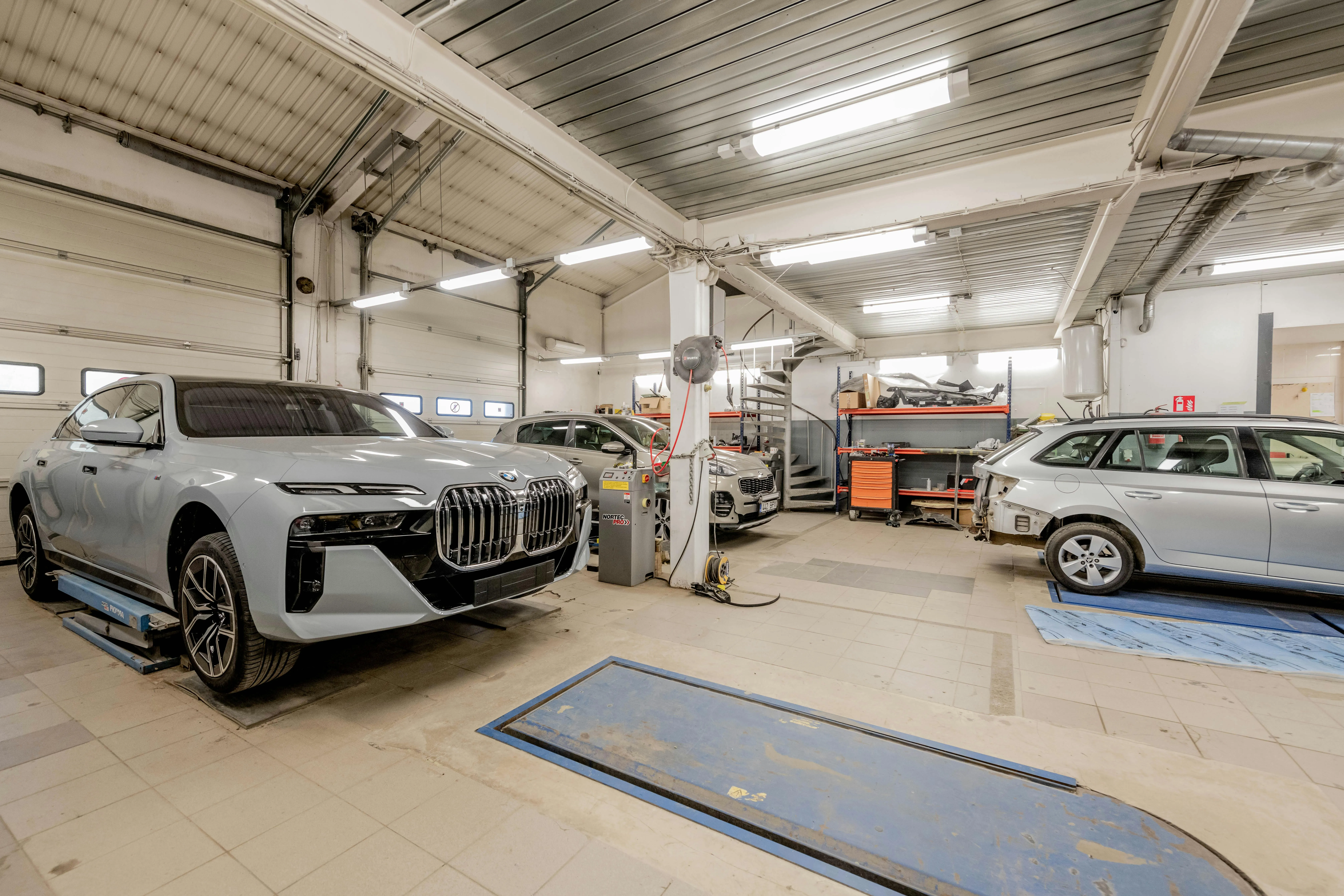 Bmw Inside a Workshop Or Service Center with Other Cars