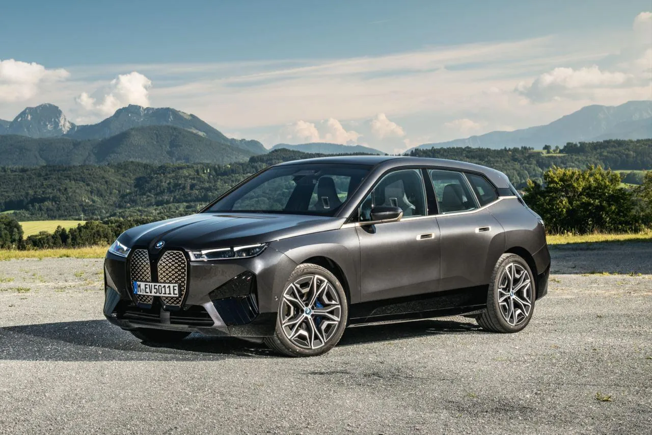 Bmw Ix Suv Parked with Scenic Mountains in the Background