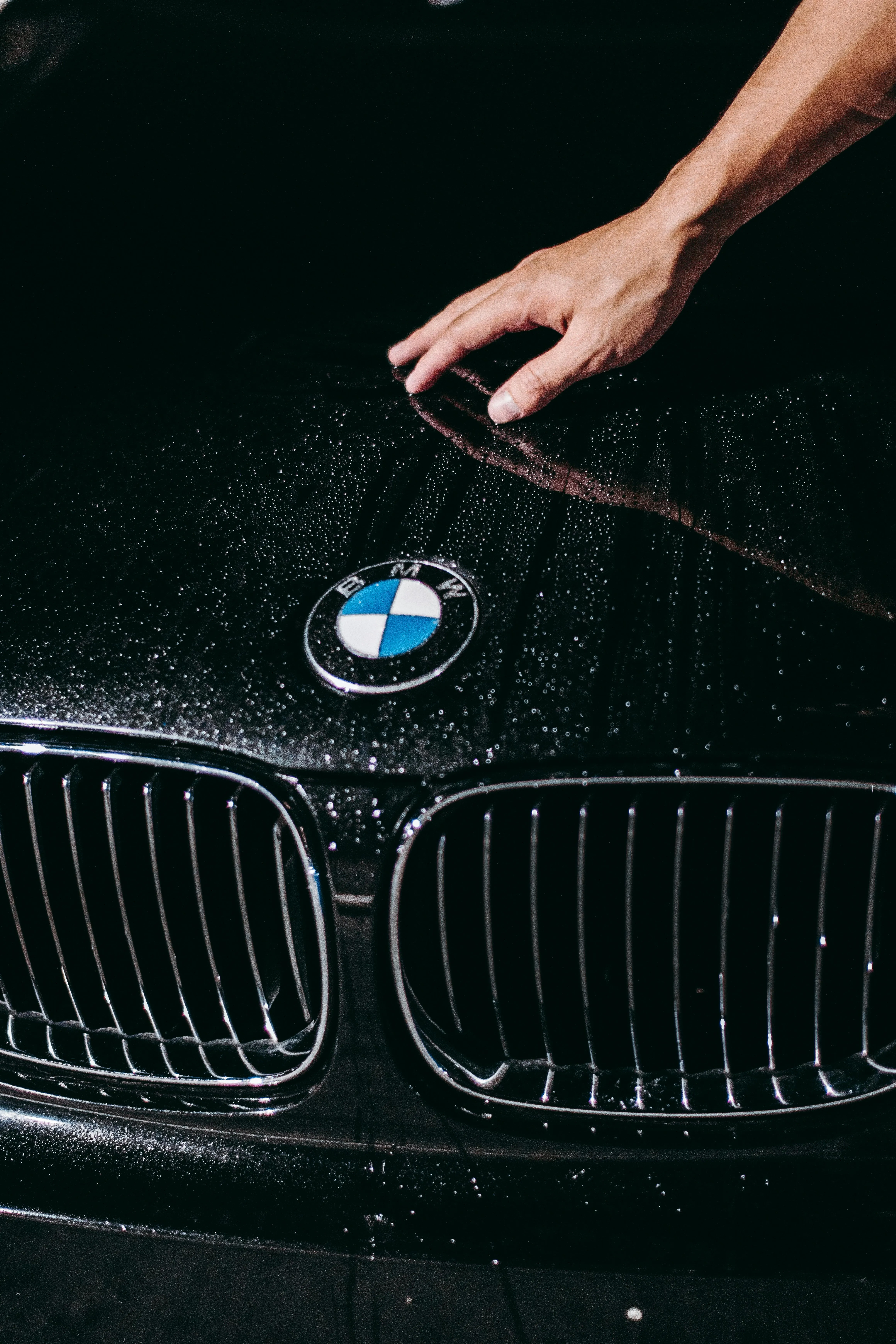 Bmw Logo and Front Grill Shown with Water Splashing Effects