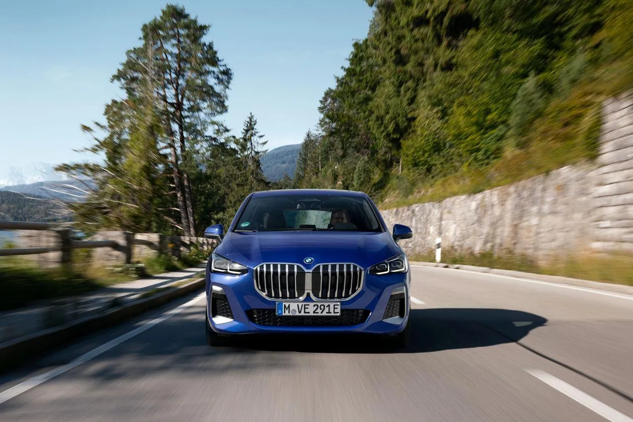 Bmw Luxury Car on a Mountain Road with Scenic Views Ahead