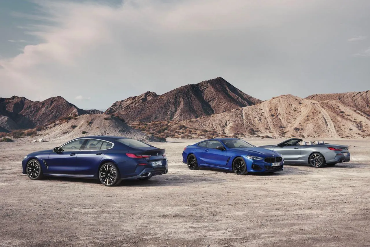 Bmw Luxury Cars Lined Up on a Rocky Mountain Road in the Desert