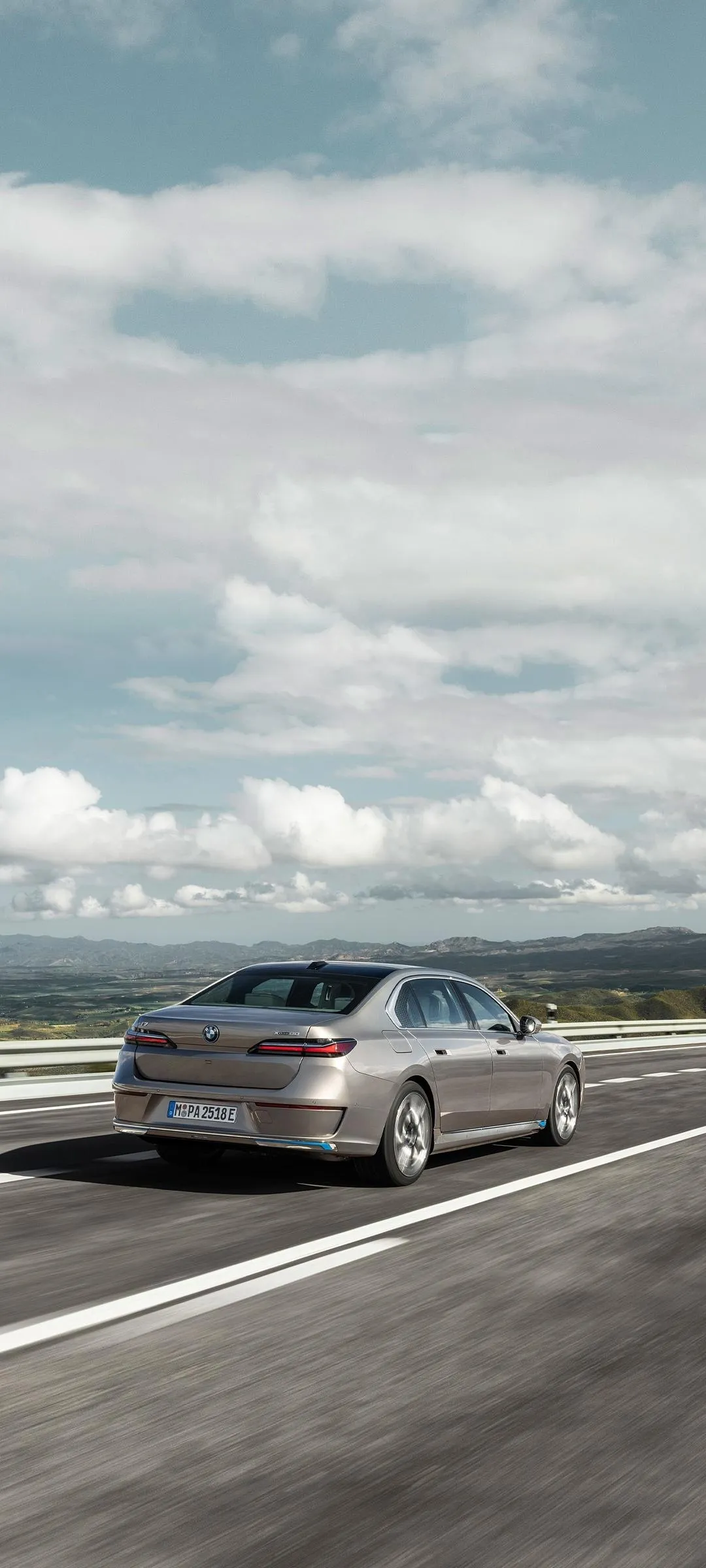 Bmw Luxury Sedan Cruising on a Highway in the Mountains