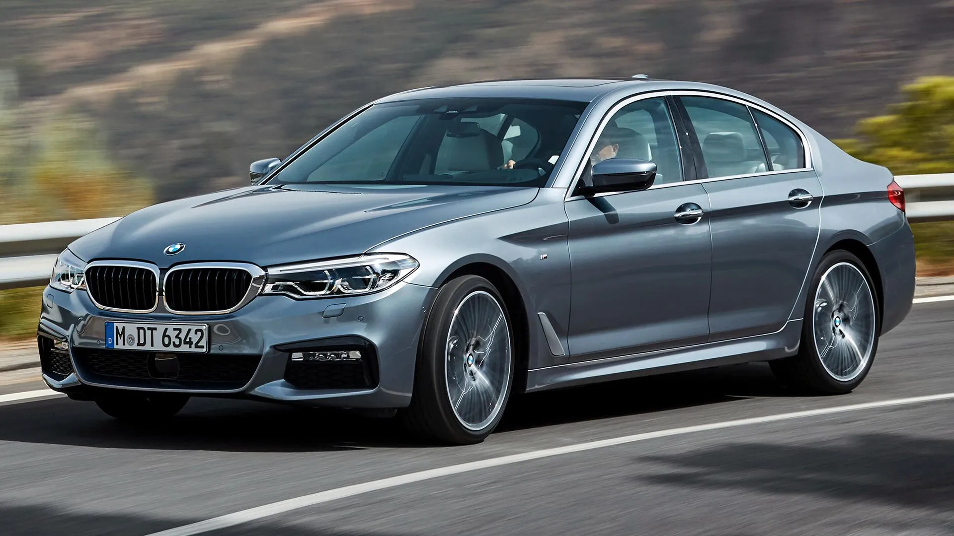 Bmw Luxury Sedan on Highway with Scenic Background
