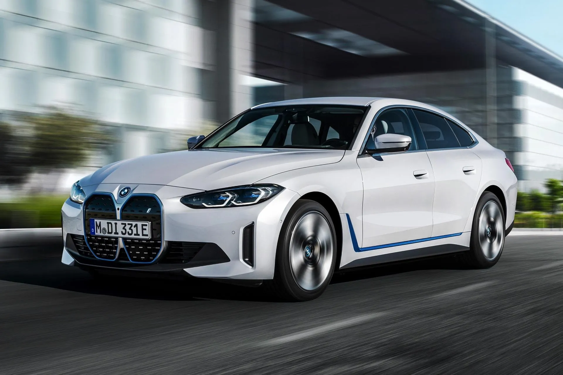 Bmw Luxury Sedan Parked in Front of Modern Glass Building
