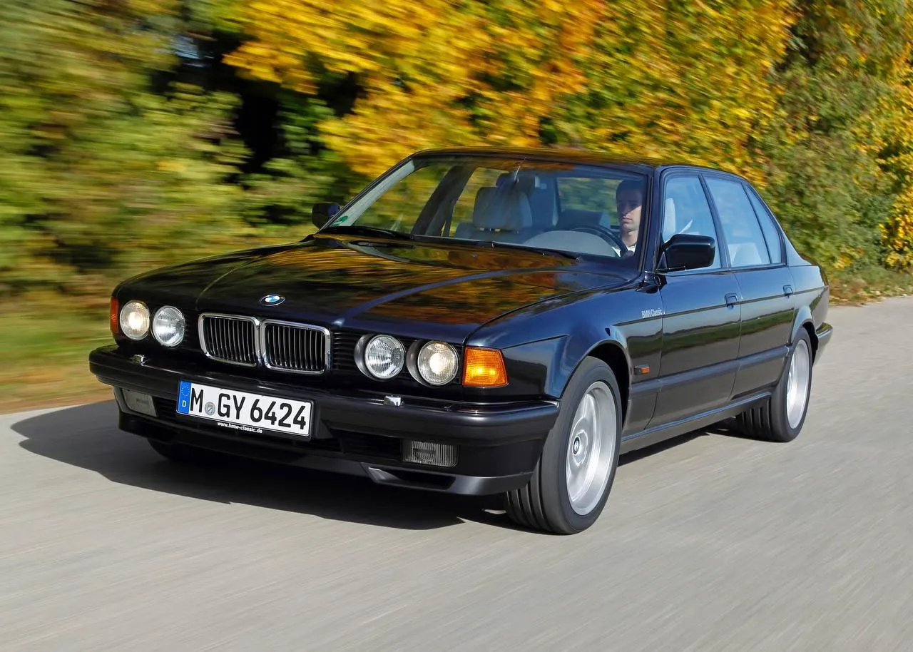 Bmw Luxury Sedan Parked Under Trees with Clear Blue Sky
