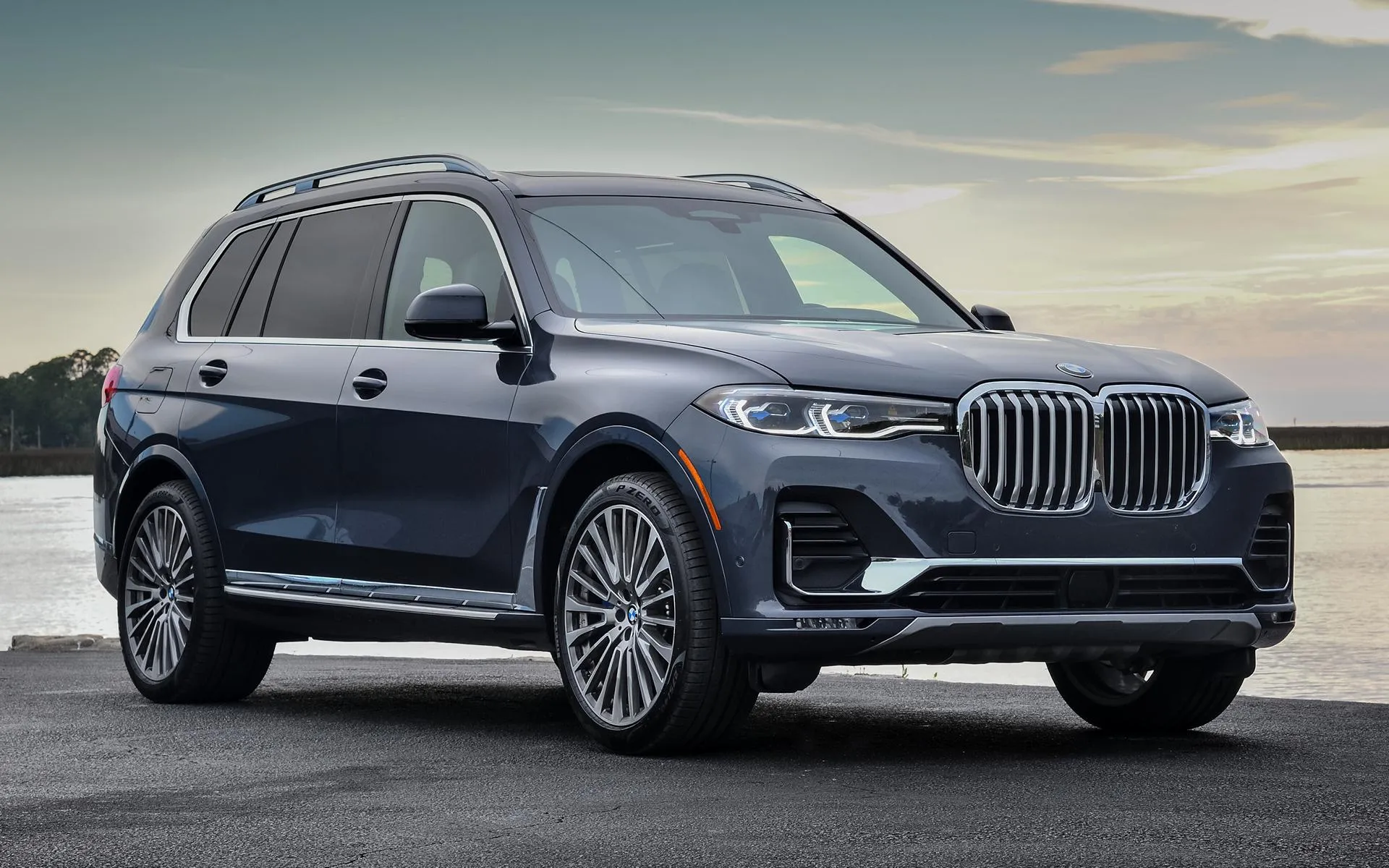 Bmw Luxury Suv Driving on Coastal Road Near Ocean View