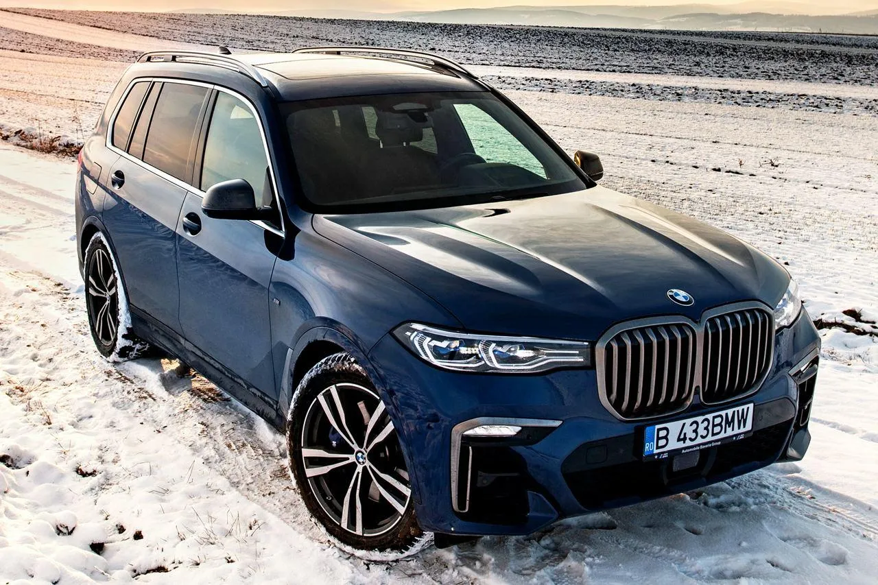 Bmw Luxury Suv Parked in Snowy Outdoor Landscape Wallpaper