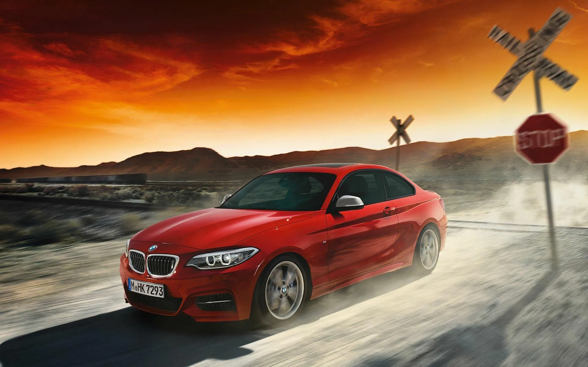 Bmw M Series Car Driving on a Dramatic Sunset Road Image