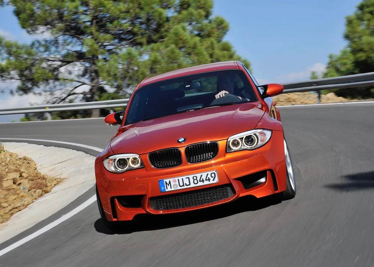 Bmw M Series Car Speeding Through Mountain Roads