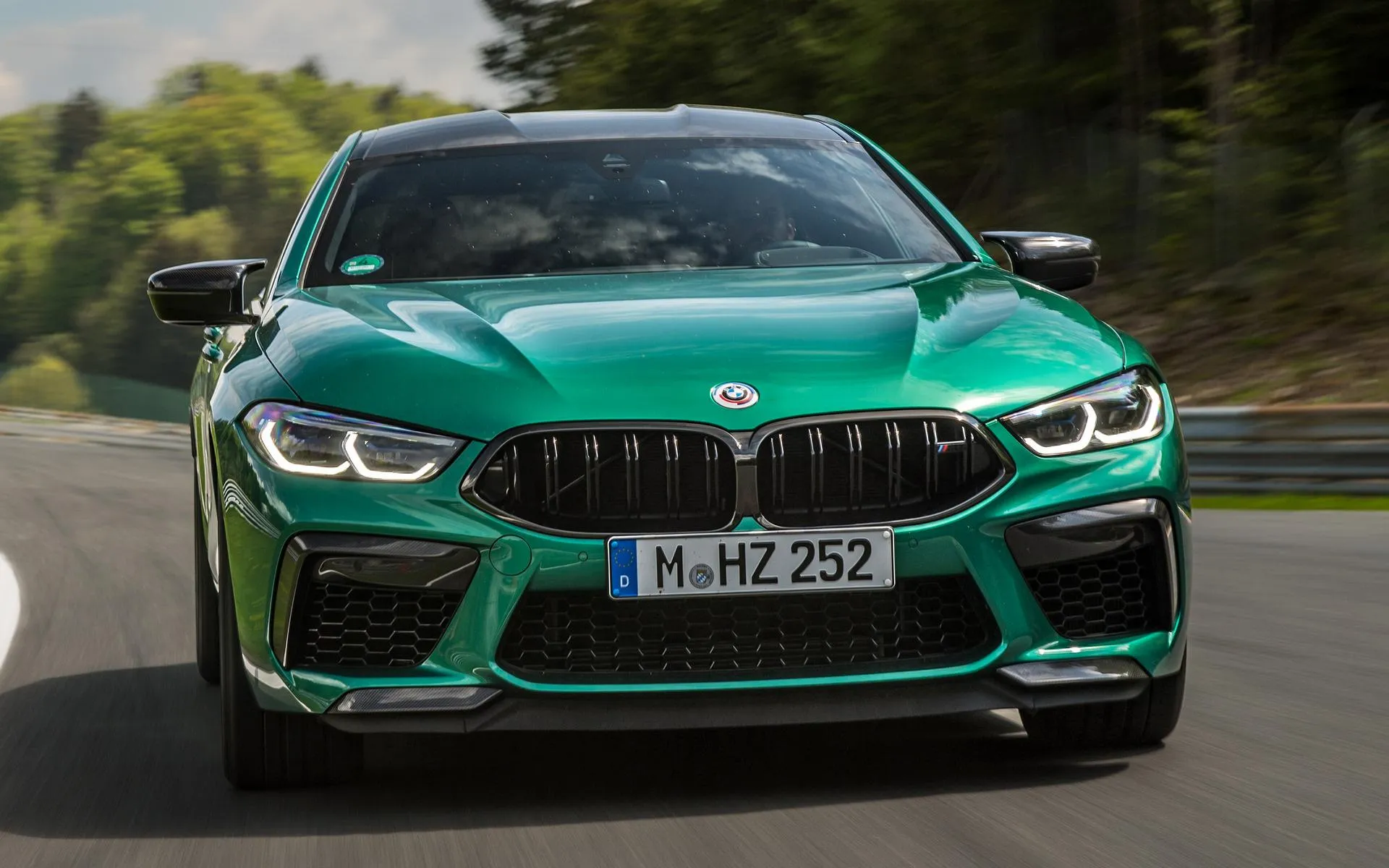 Bmw M Series Driving Fast on a Mountain Road Image