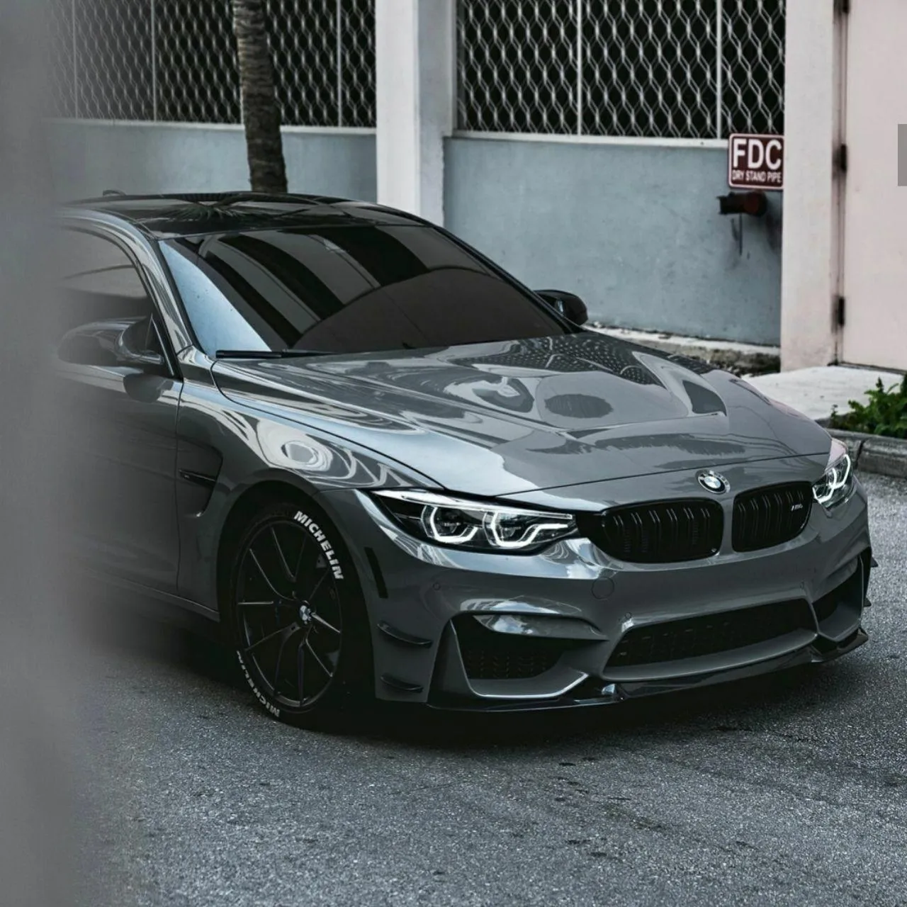 Bmw M3 in Urban Setting with Sleek Grey Finish Image