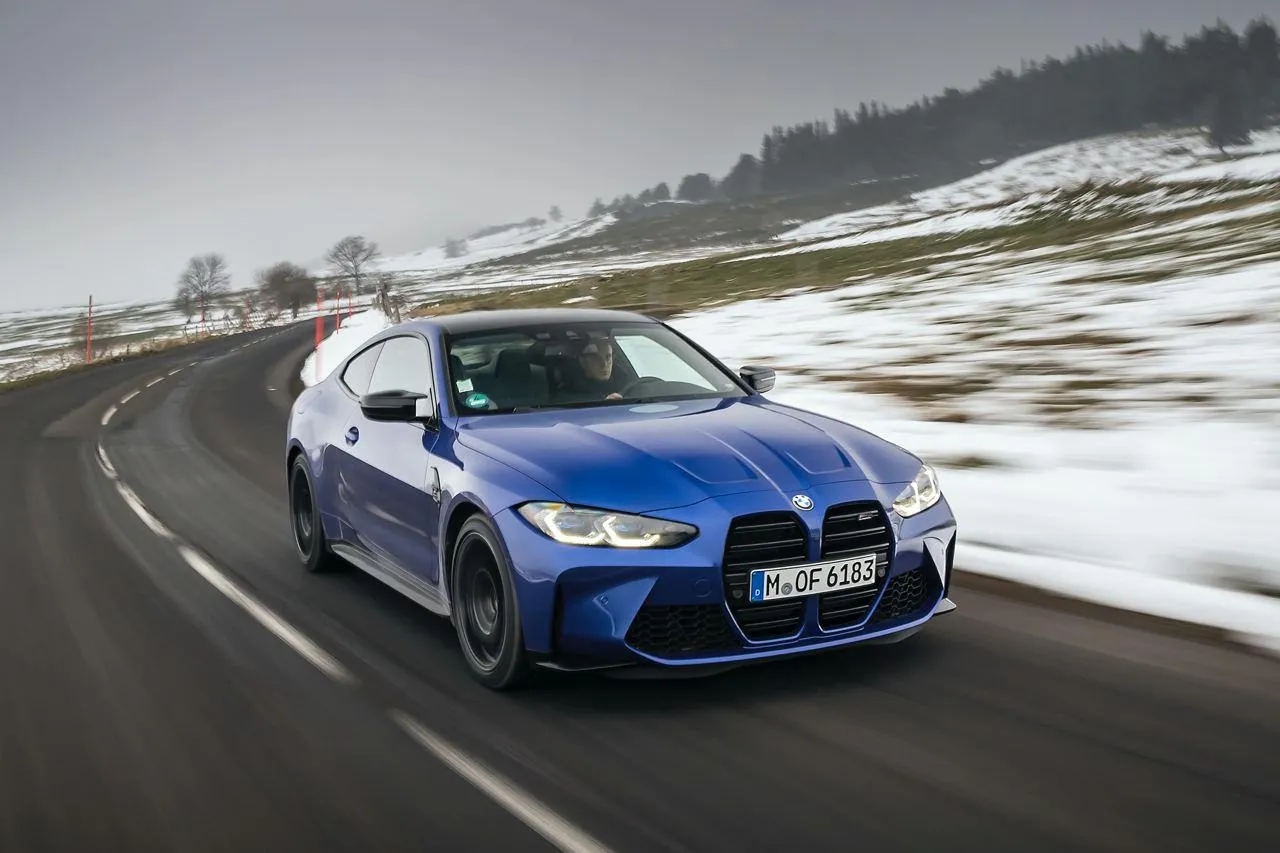 Bmw M3 Racing Through Snow Covered Mountain Road Image