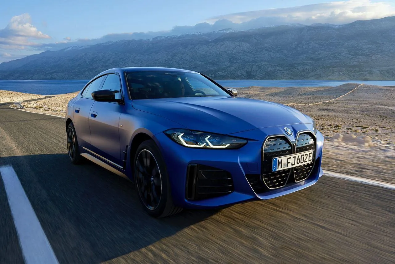 Bmw M4 Driving Through a Wide Open Road with Scenic Views