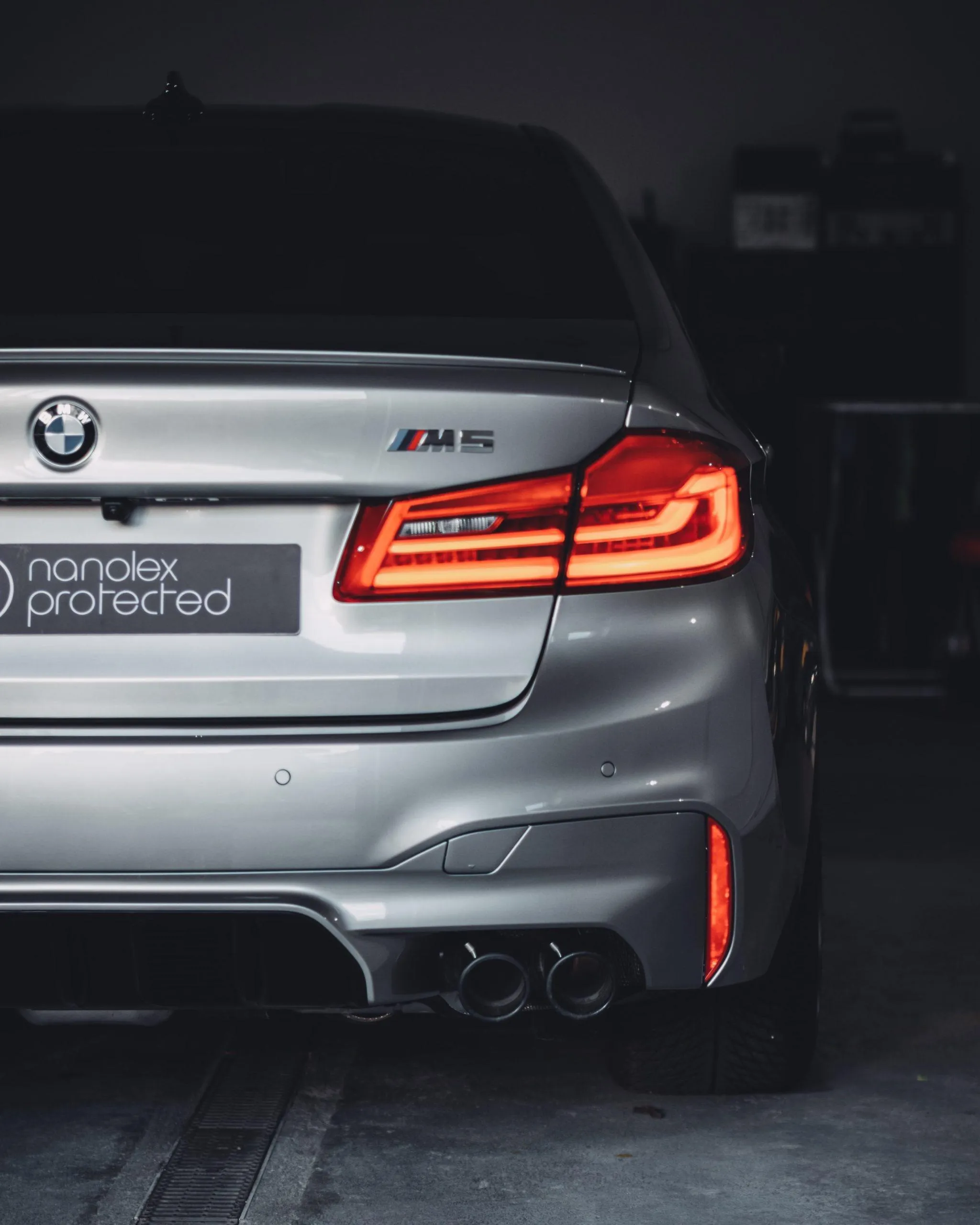 Bmw M5 Rear Shot in Dark Garage with Taillights On