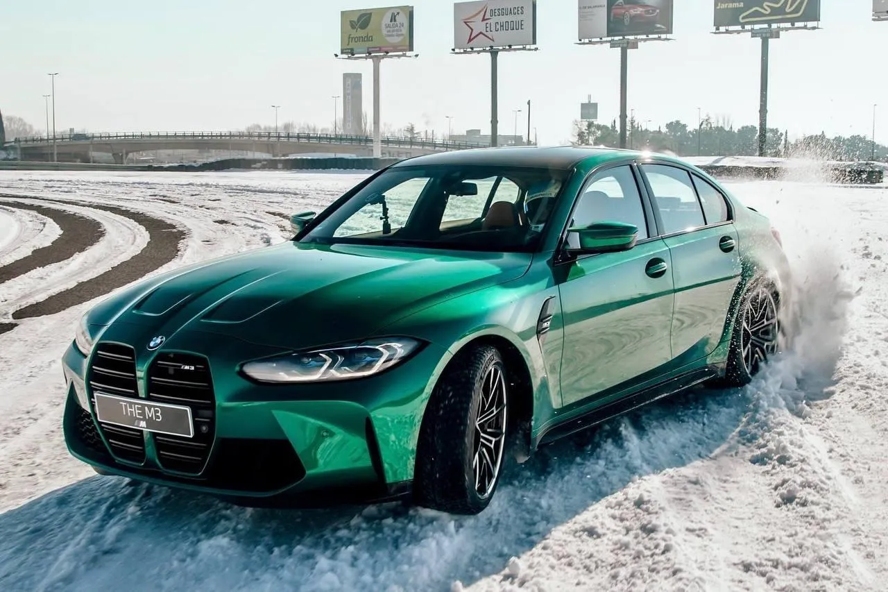 Bmw Modern Green Car Driving on Snow Covered Road