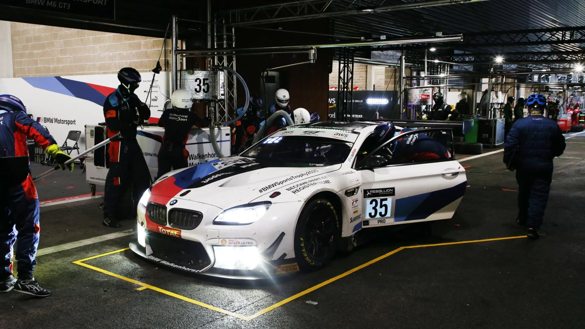 Bmw Motorsport Team Preparing Race Car Inside Paddock Area