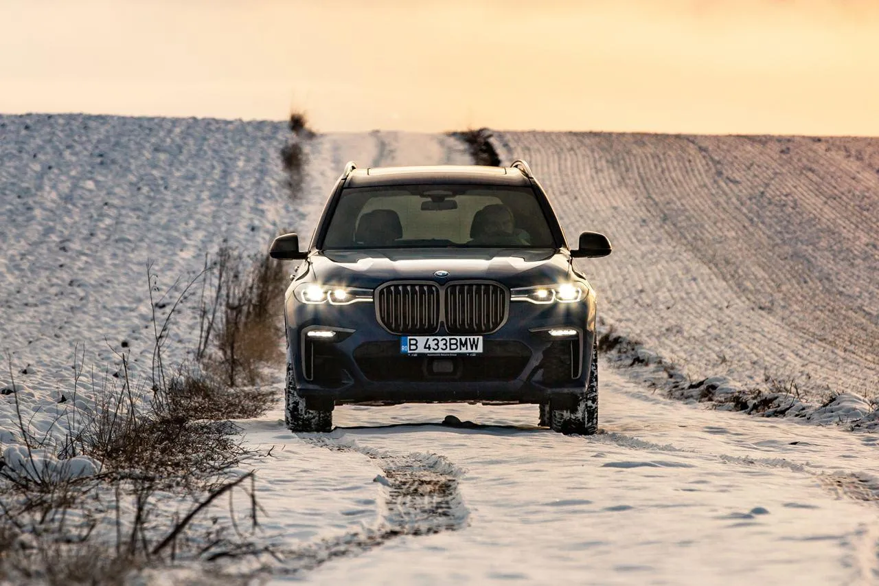 Bmw Off Road Vehicle Driving Through Snowy Terrain