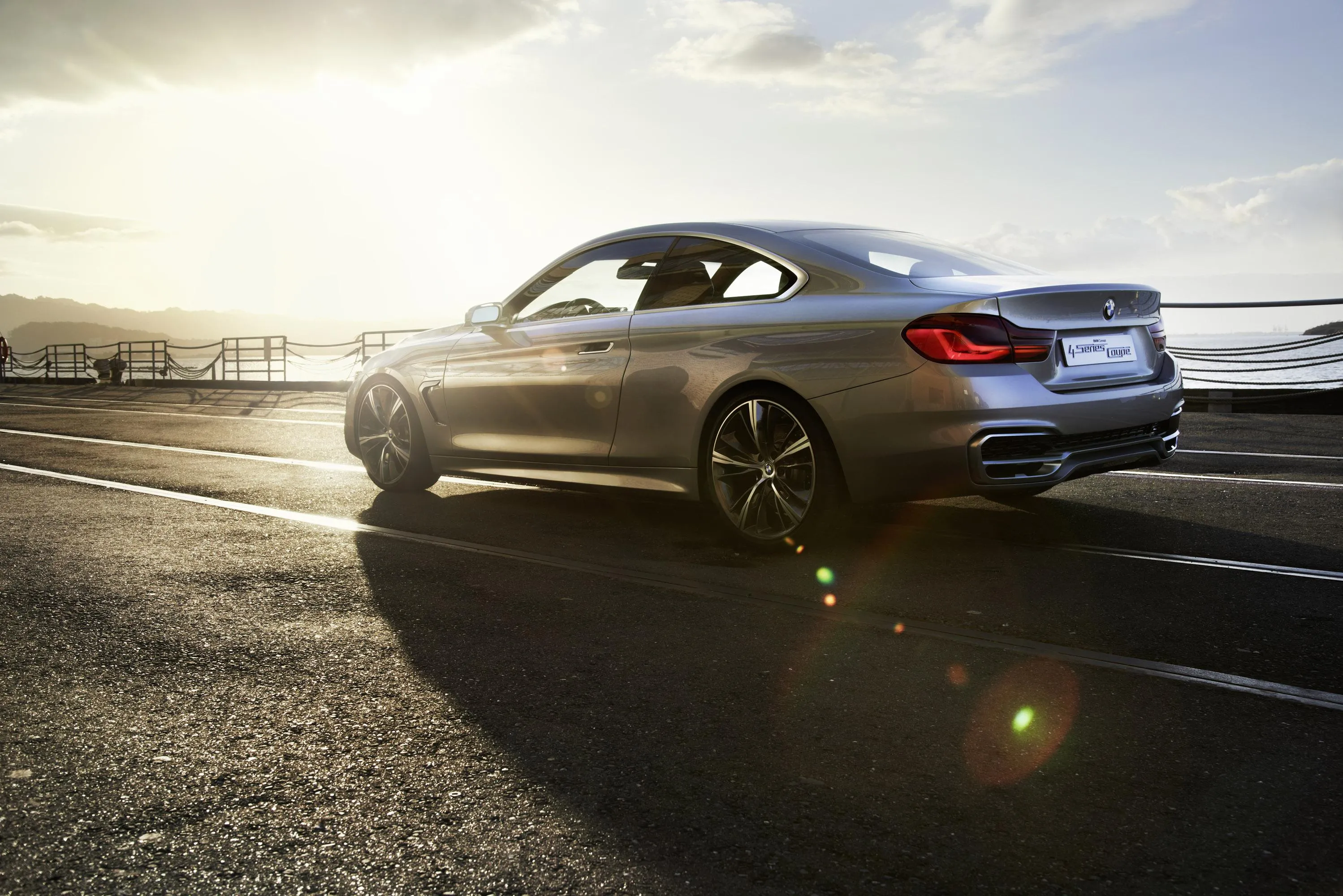 Bmw on Highway at Sunset with Bright Reflections Image