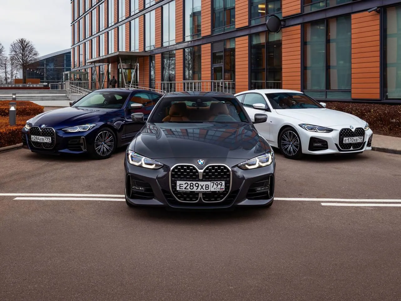 Bmw Parked Alongside Other Cars in a City Parking Lot