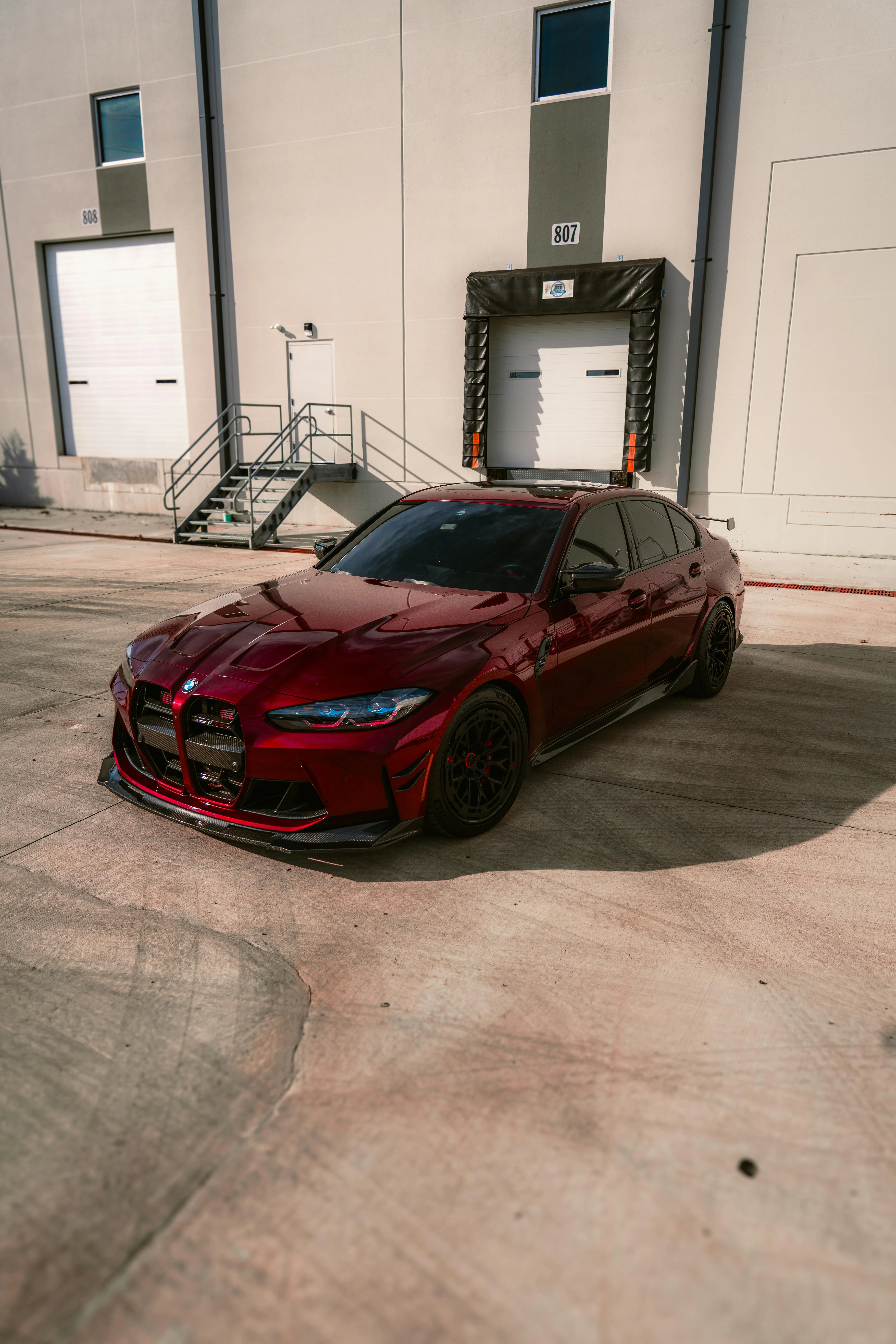 Bmw Parked in an Empty Concrete Lot with Soft Lighting