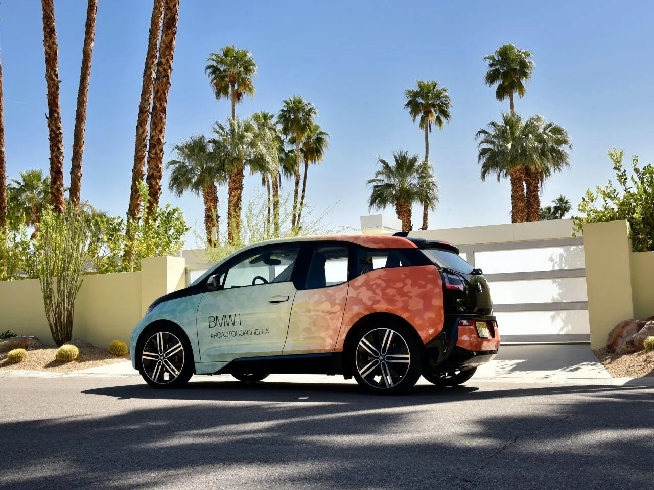 Bmw Parked Near Palm Trees in a Sunny Residential Area