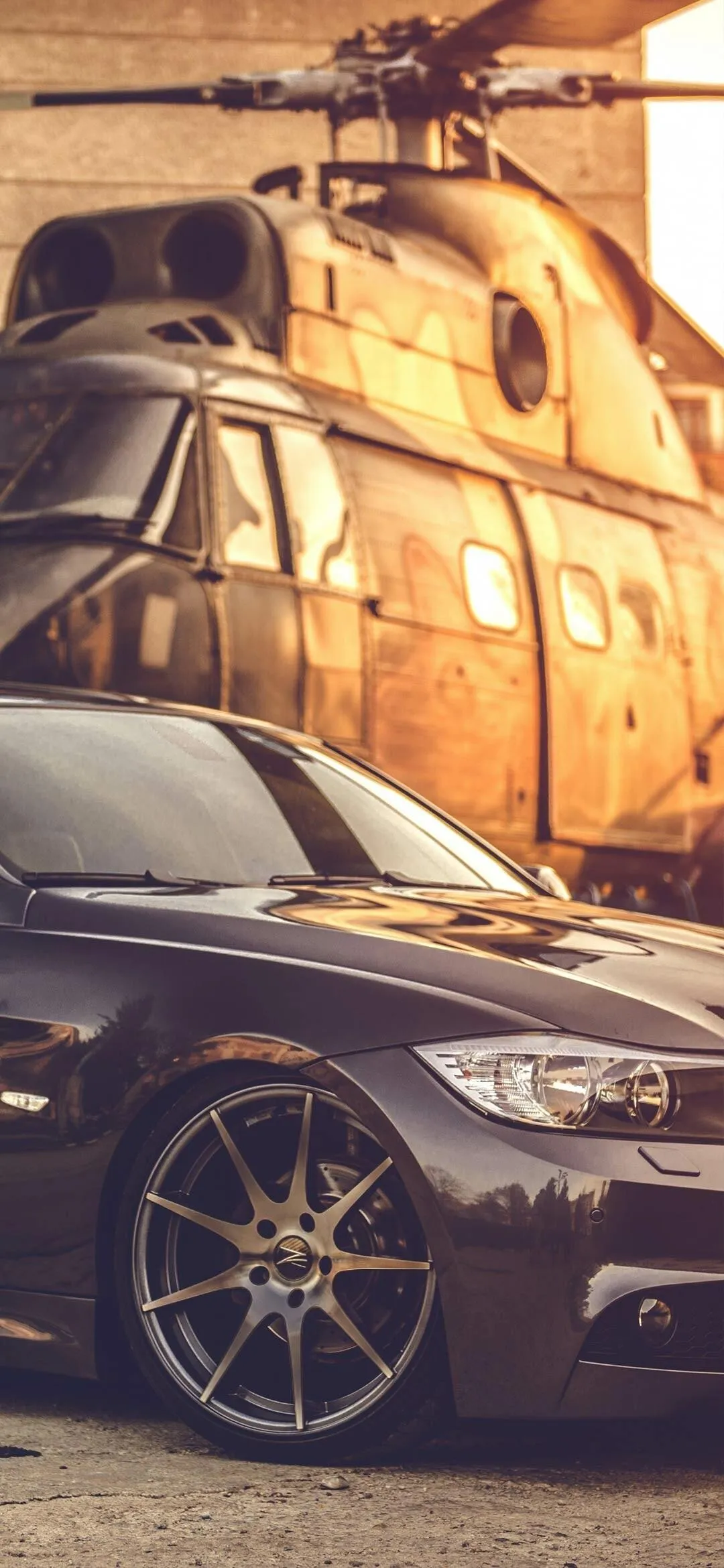 Bmw Performance Car Near Helicopter on Airfield Wallpaper