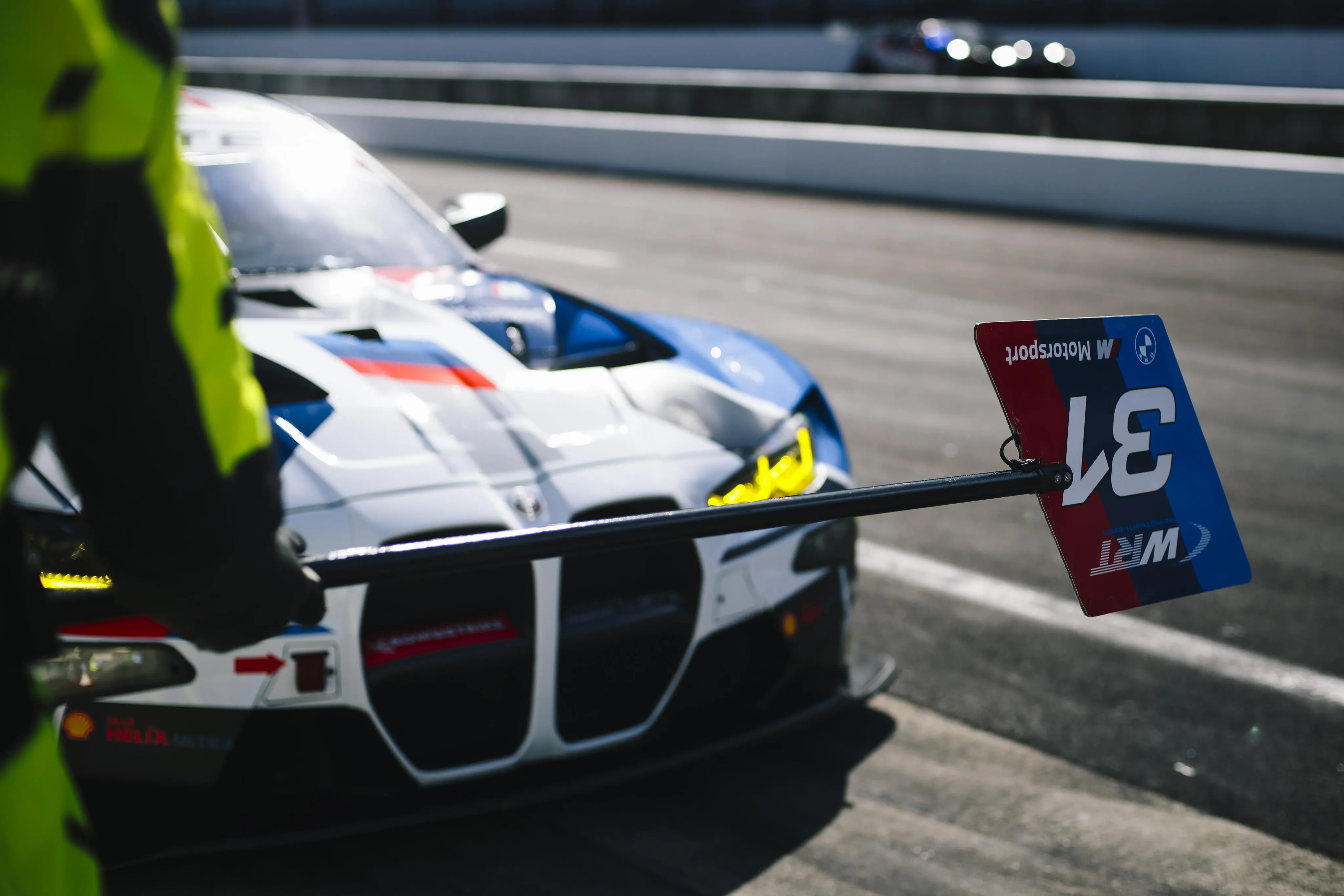 Bmw Race Car at Pit Stop During a Motorsport Event 4K