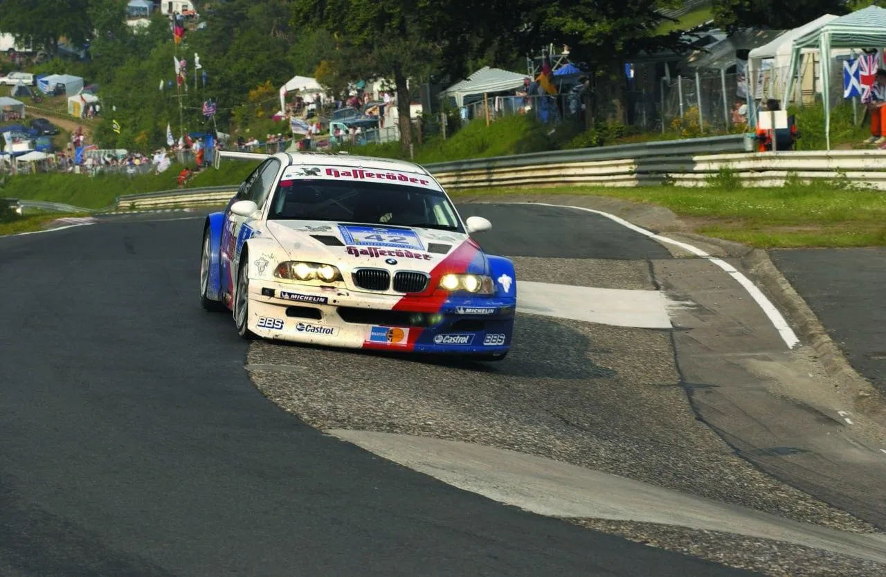 Bmw Race Car Driving on a Racetrack During an Event