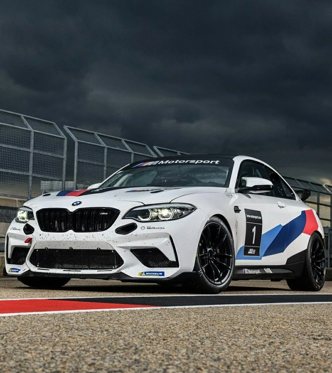 Bmw Race Car in Action During a High Speed Track Lap