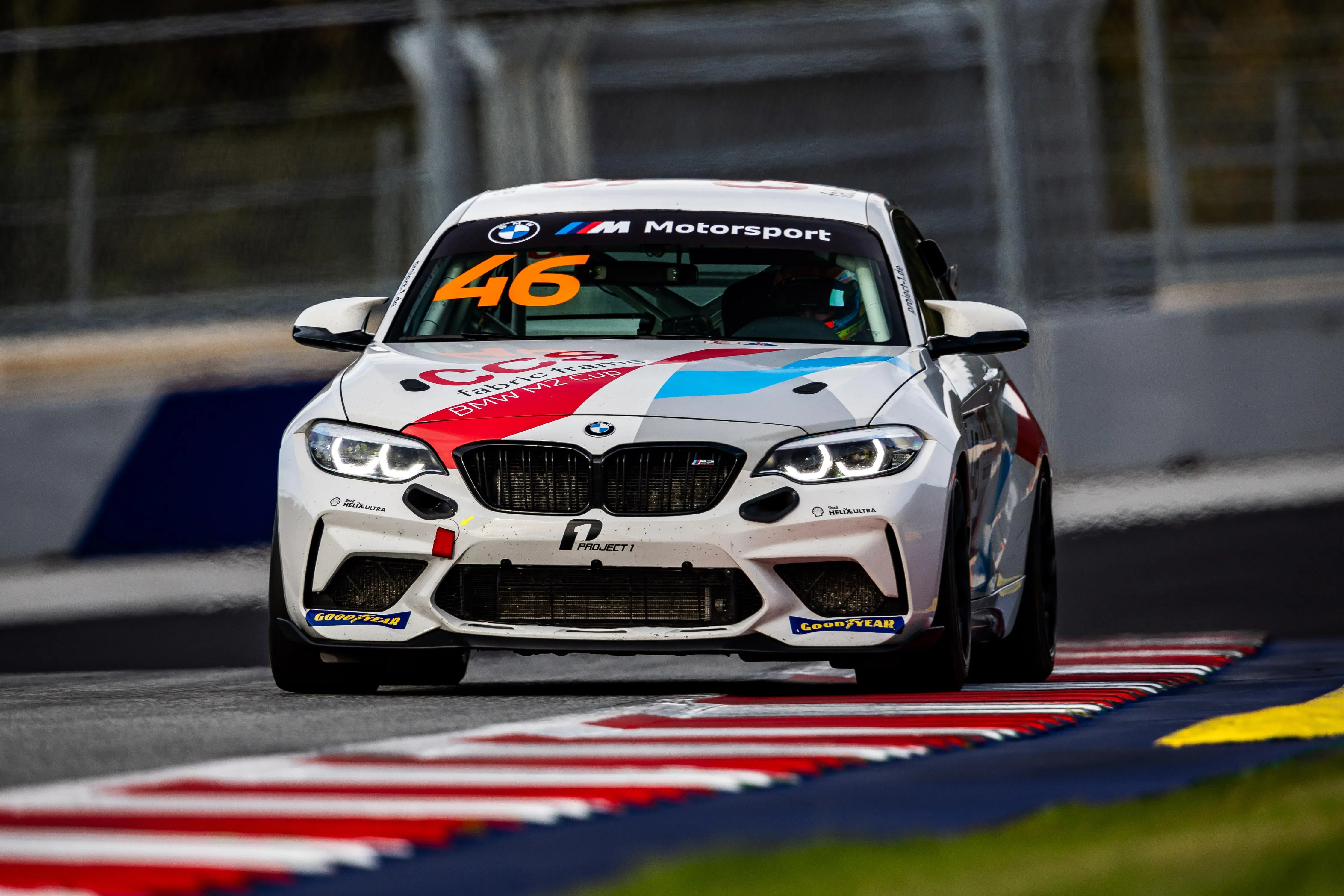 Bmw Race Car on Track with Number Forty Six Decal Displayed