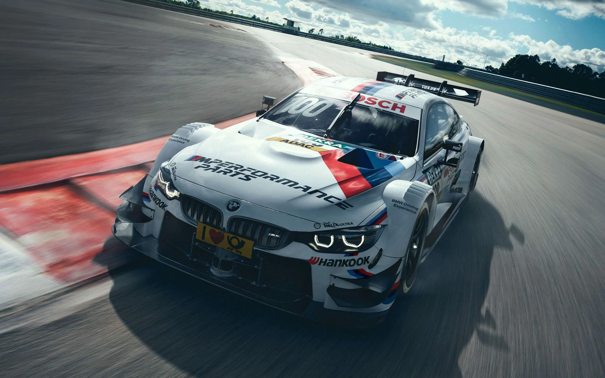 Bmw Race Car Speeding on Professional Racetrack in Motion
