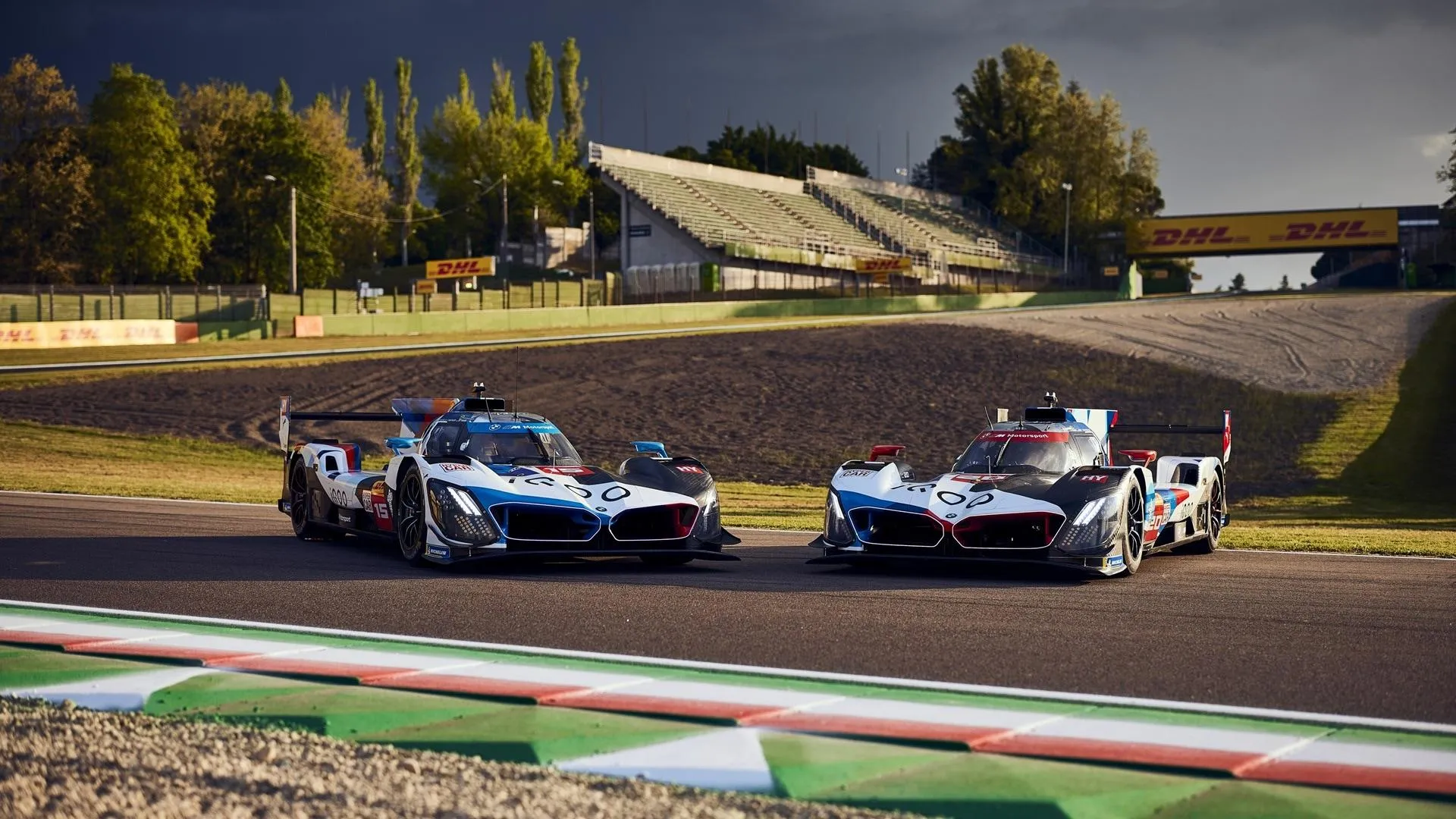 Bmw Race Cars Competing on Track at High Speed Corner