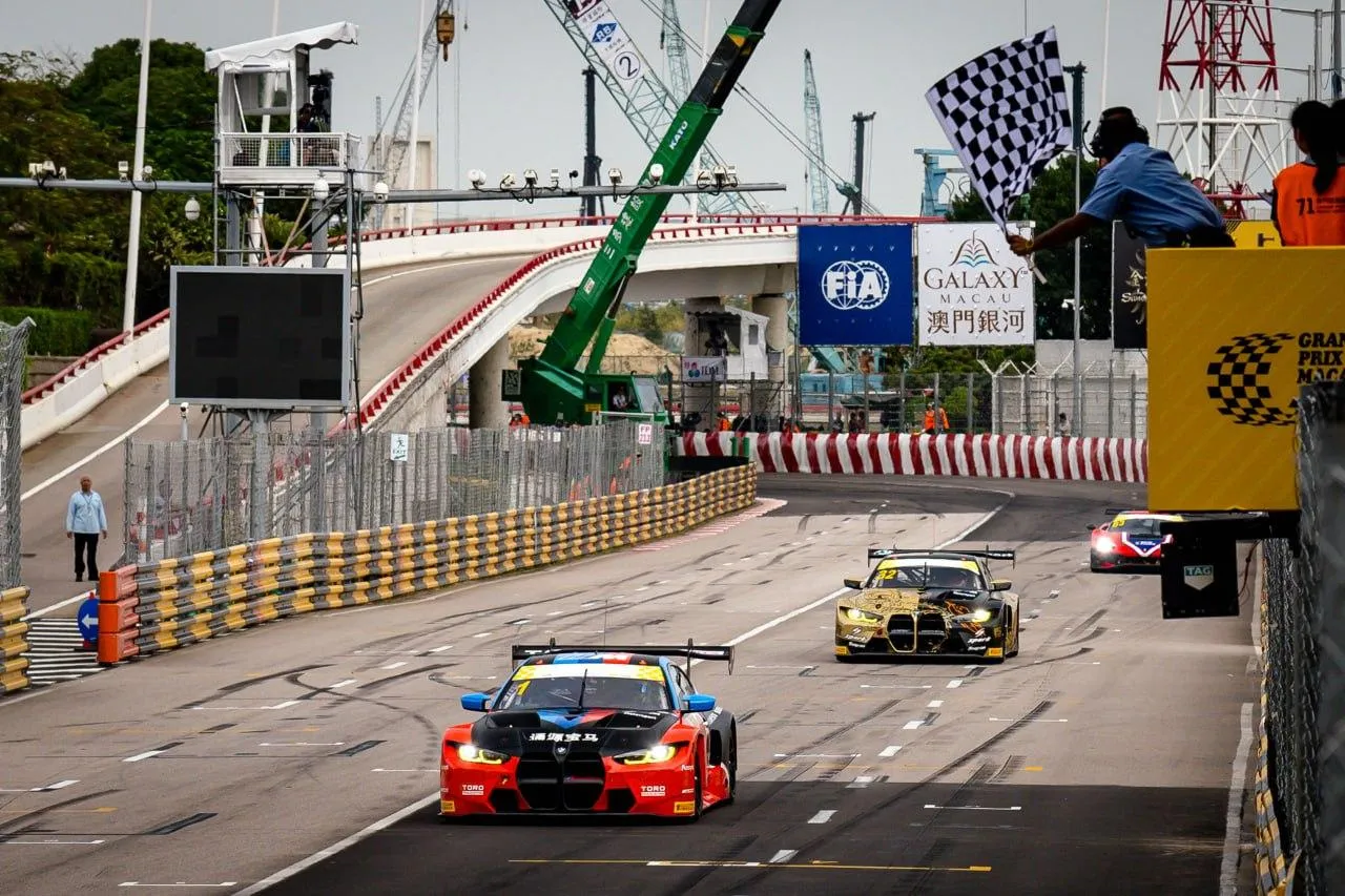 Bmw Race Cars in Action at a Busy Motorsport Track