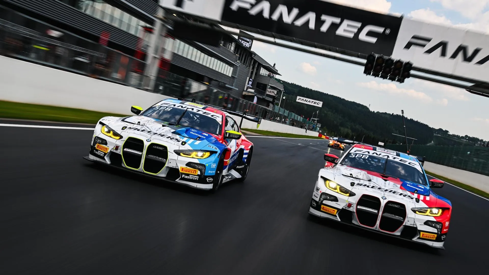 Bmw Racing Cars Zooming Down the Track in an Exciting Race