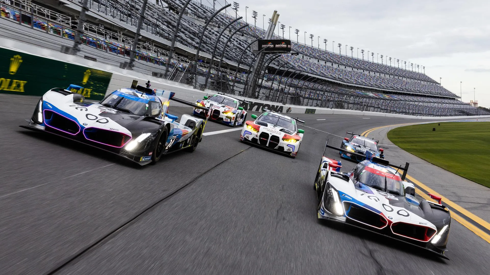 Bmw Racing on Track Among Other High Speed Race Cars