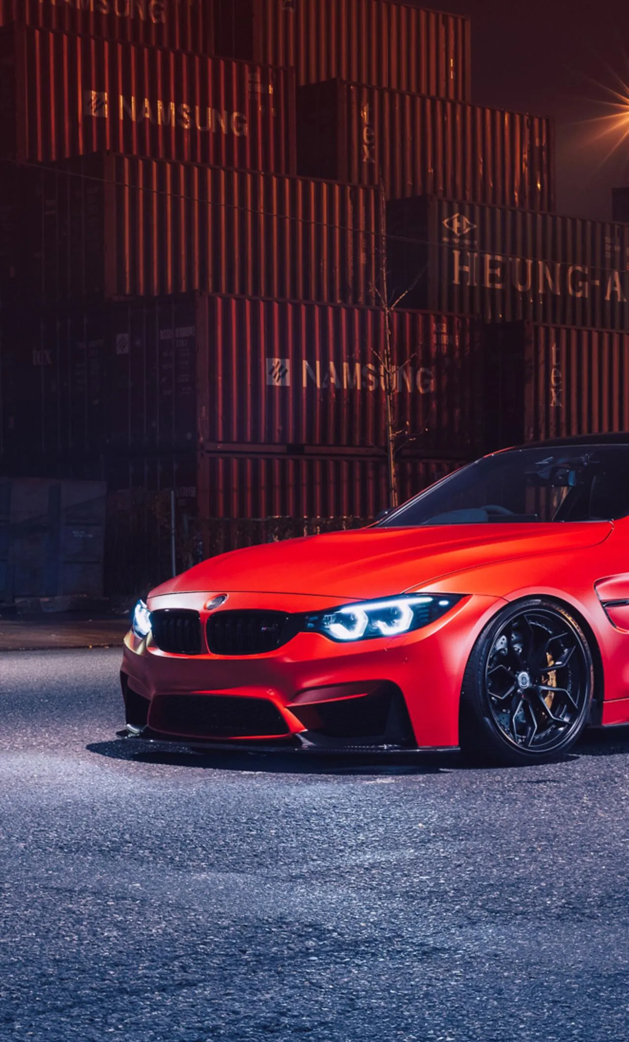 Bmw Red Car Parked in Urban Area with Dark Background