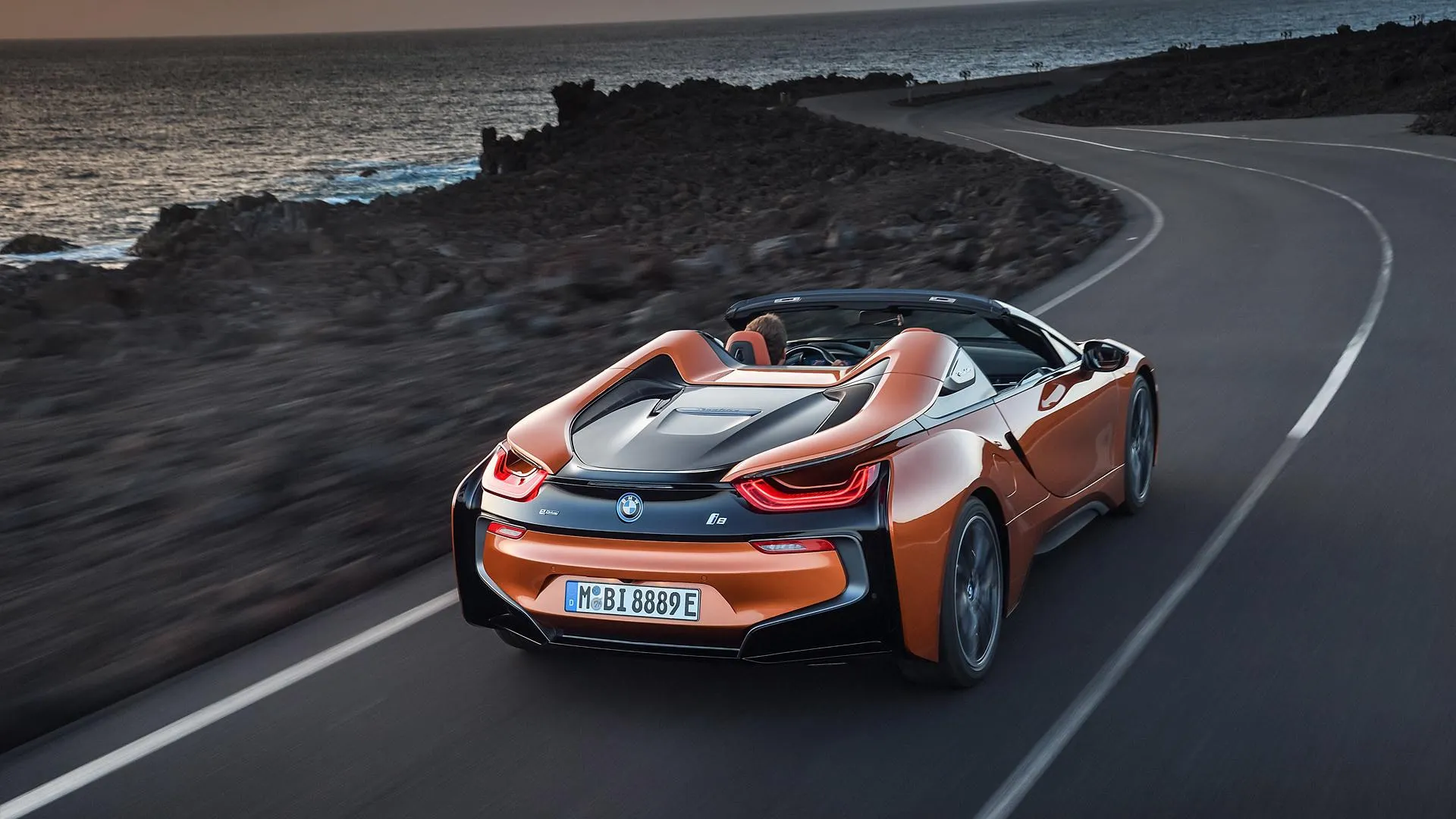 Bmw Roadster in Action on a Curved Road Near Beach Hd