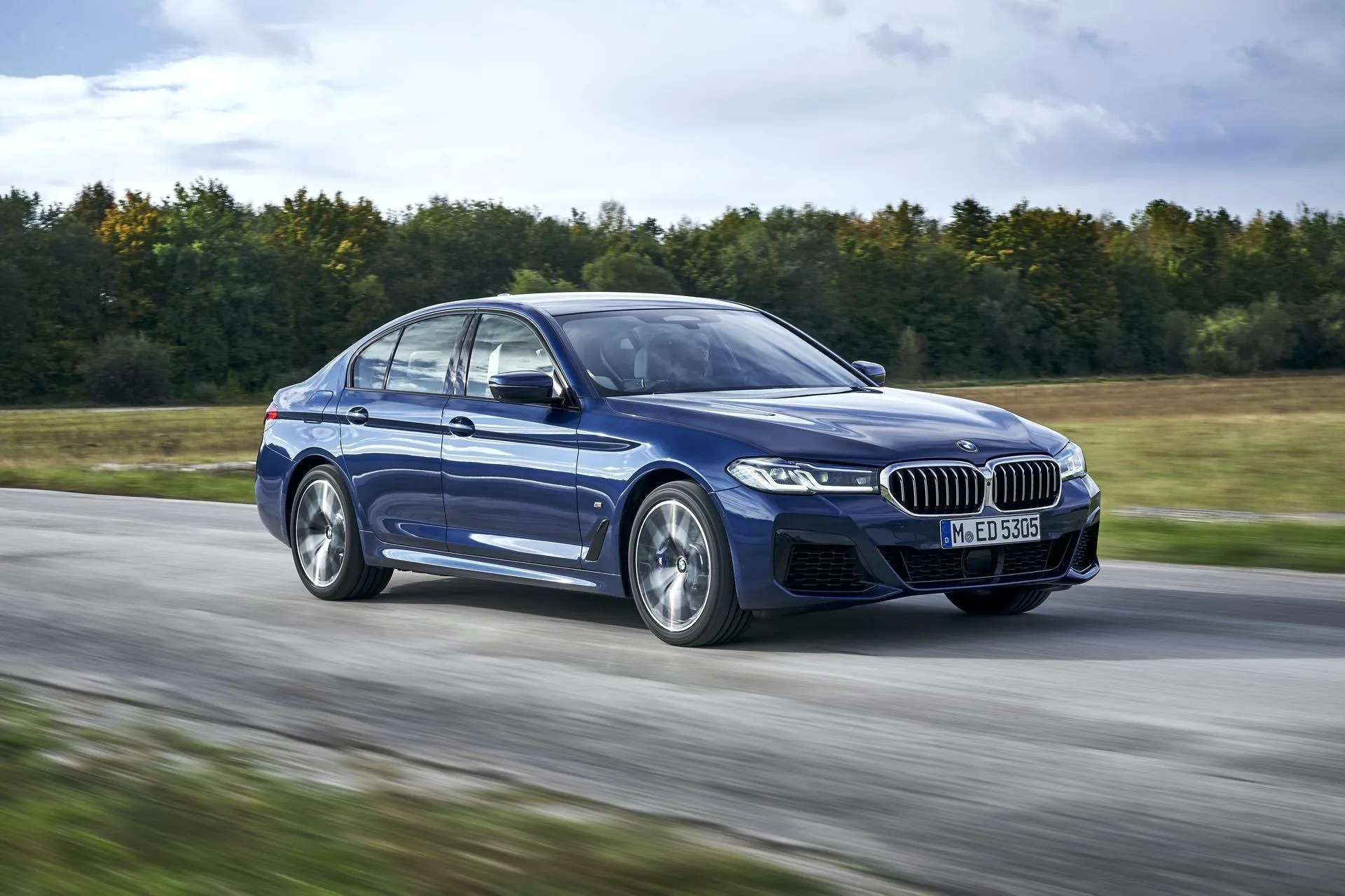 Bmw Sedan Driving on Scenic Countryside Road in Autumn
