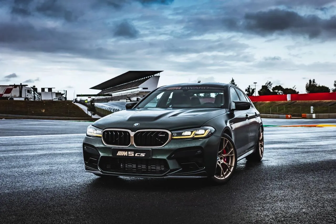 Bmw Sedan Driving Through a Dramatic Stormy Landscape